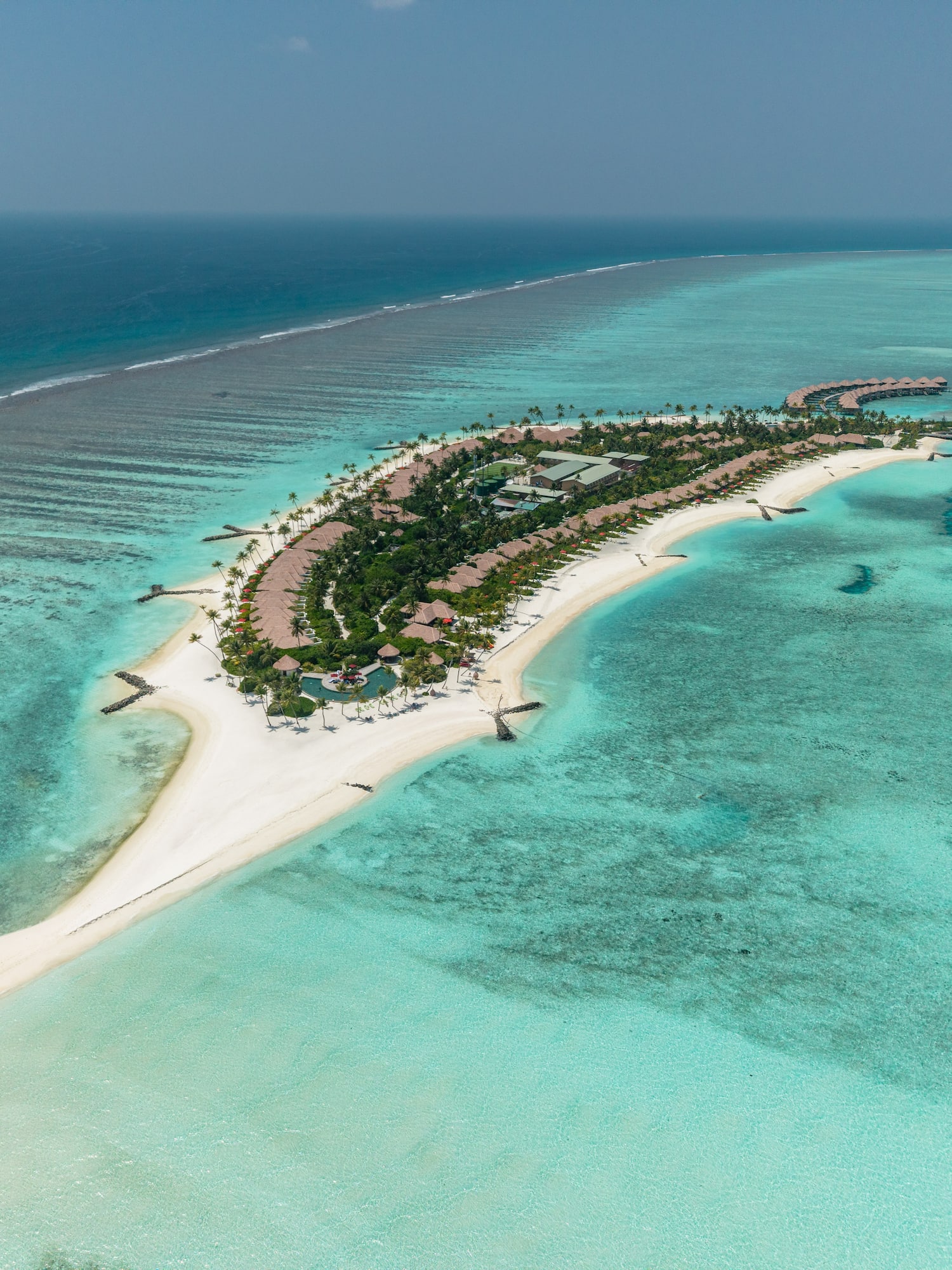 an island with buildings and a beach