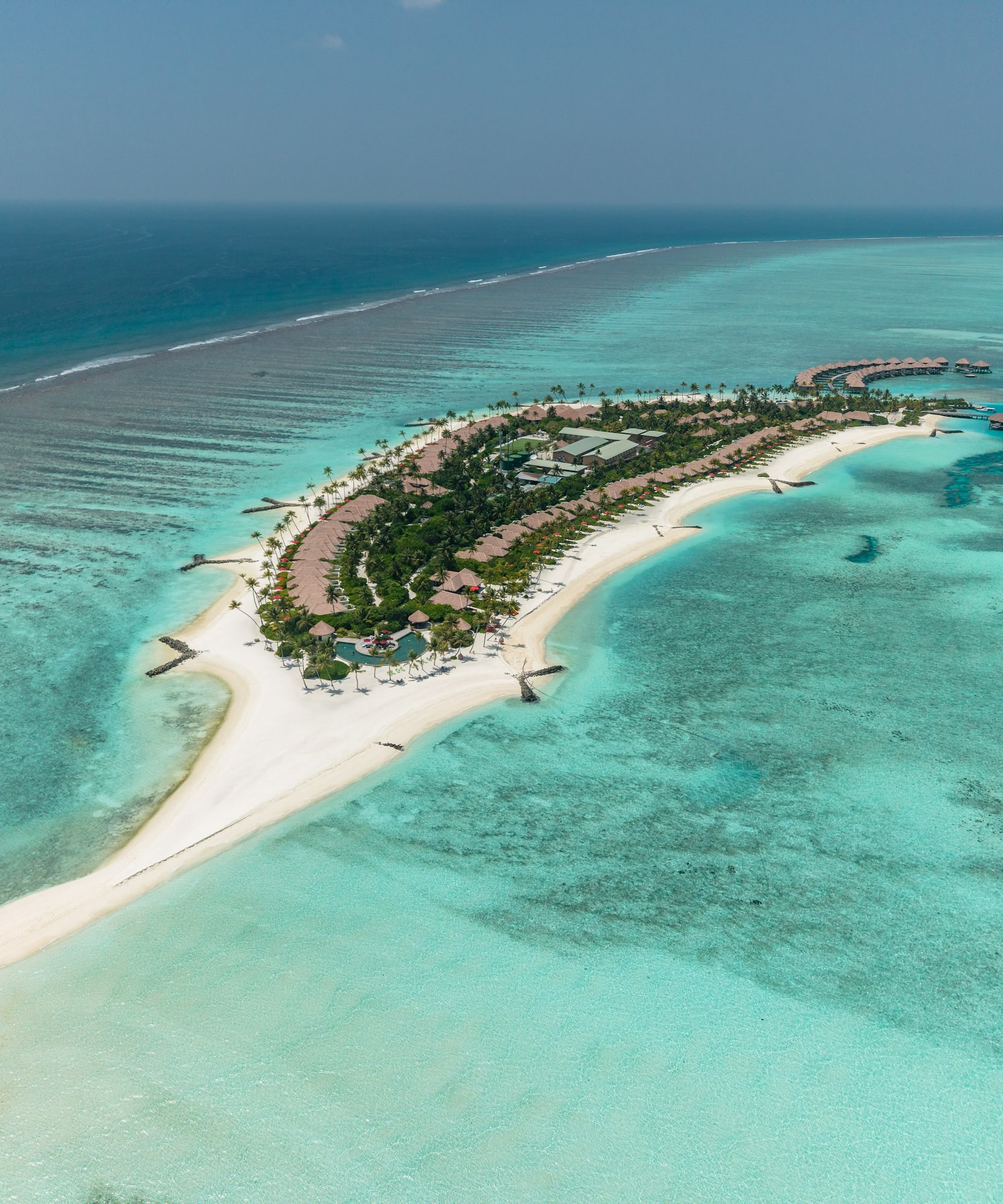 an island with buildings and a beach