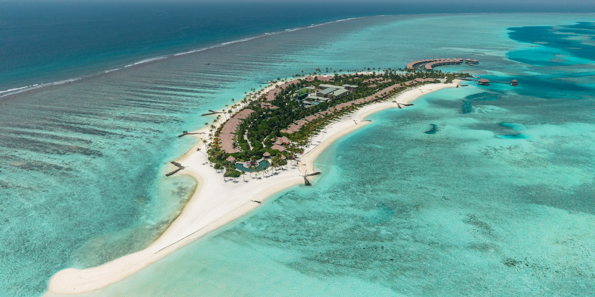 an island with buildings and a beach