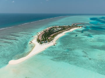 an island with buildings and a beach