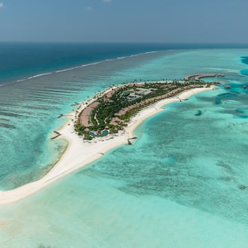 an island with buildings and a beach