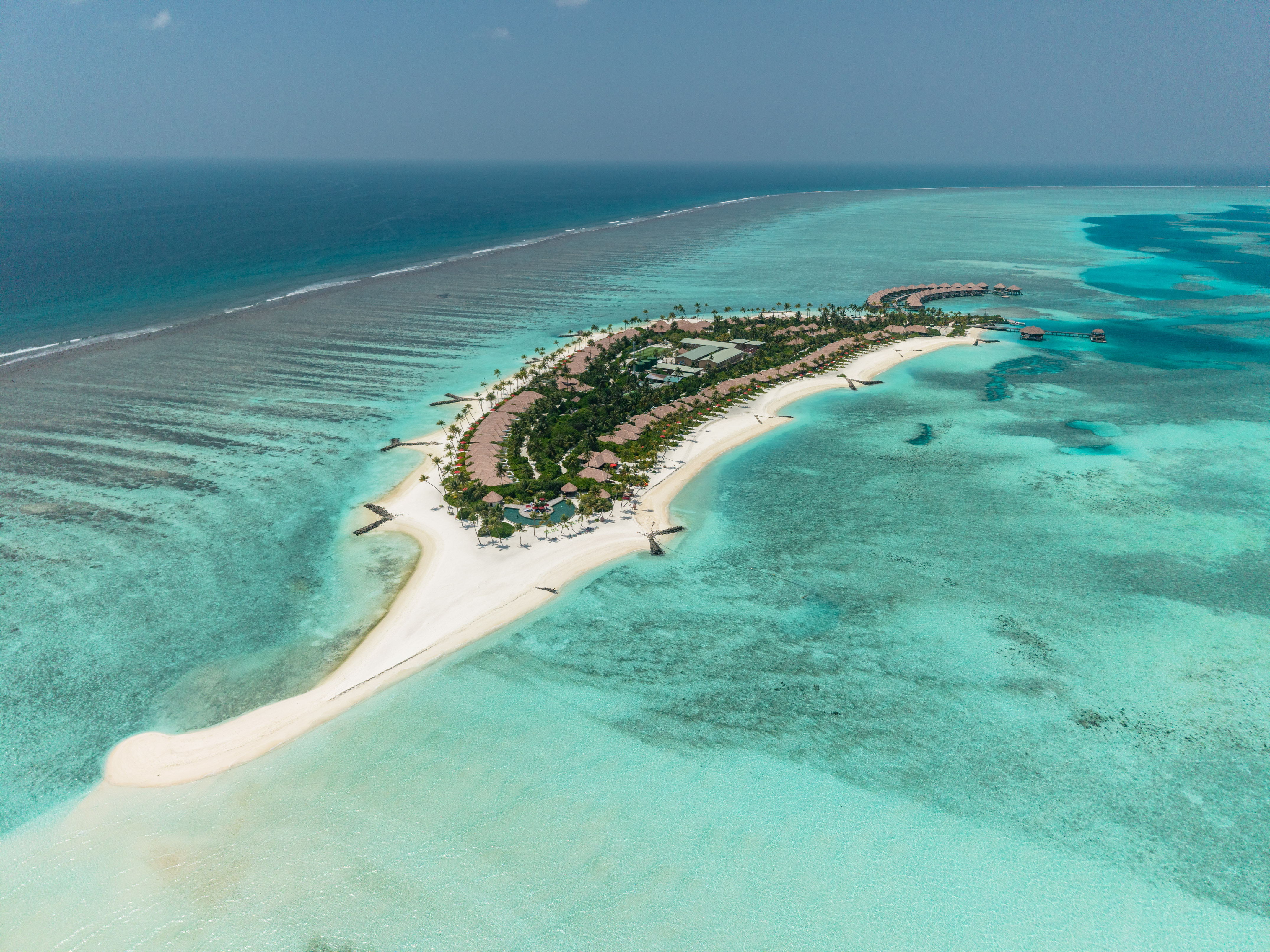 an island with buildings and a beach