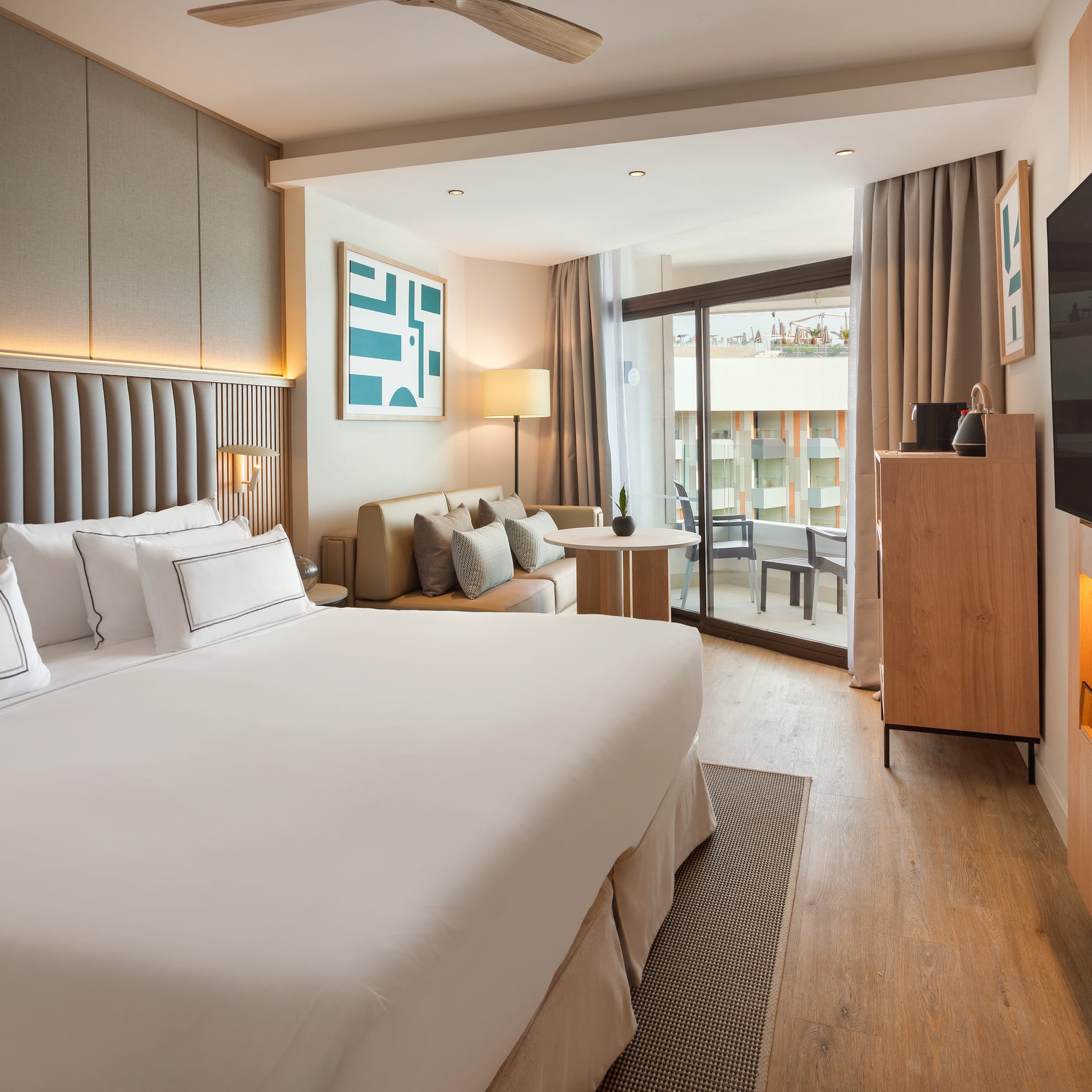 a room with a bed and a television