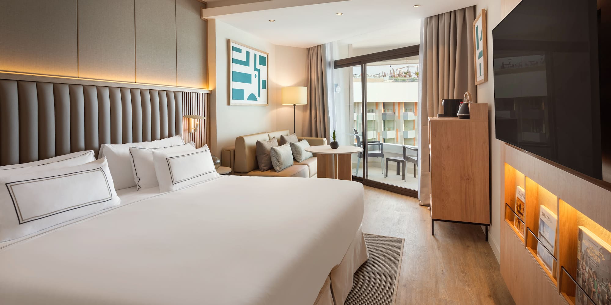 a room with a bed and a television