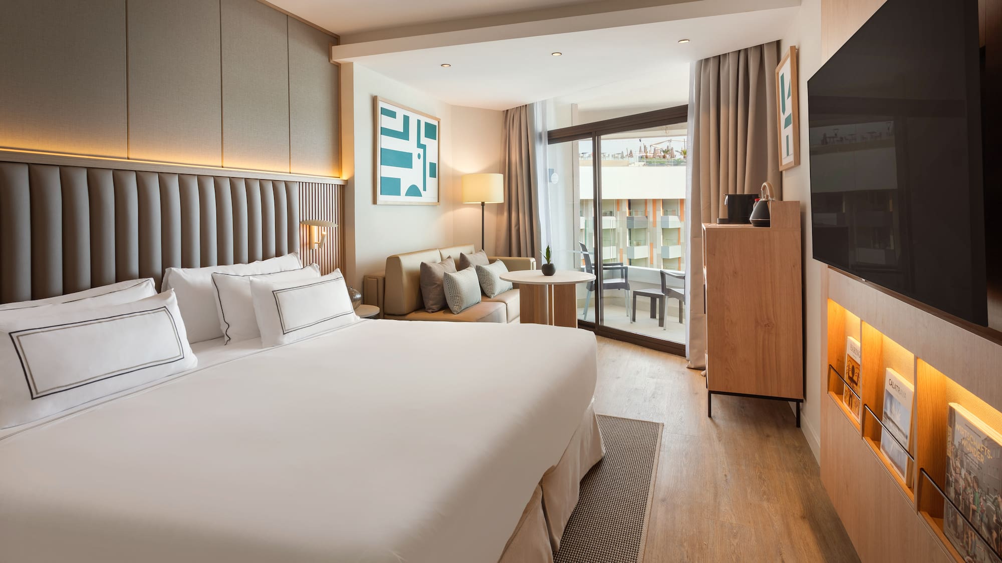 a room with a bed and a television