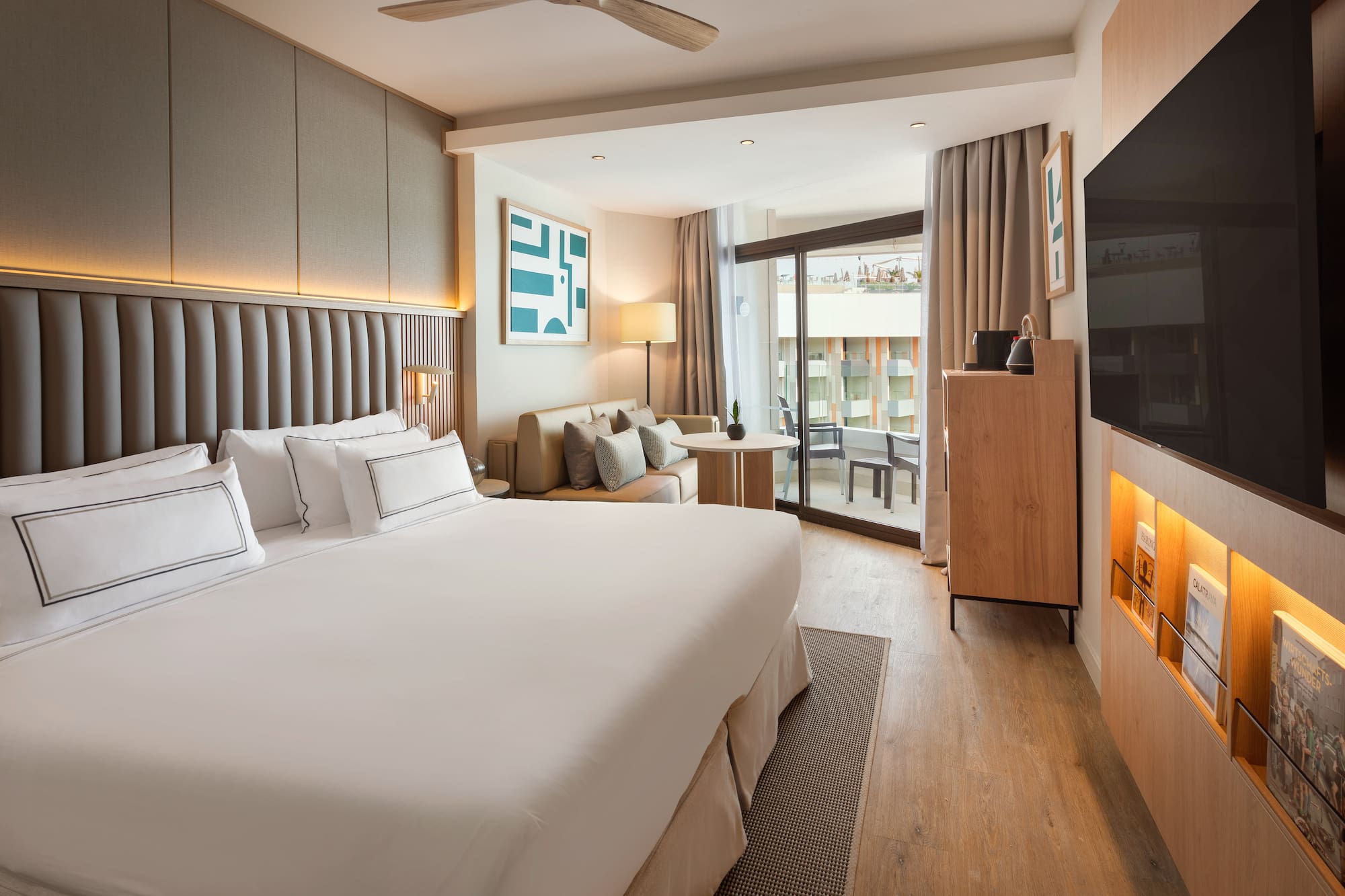 a room with a bed and a television