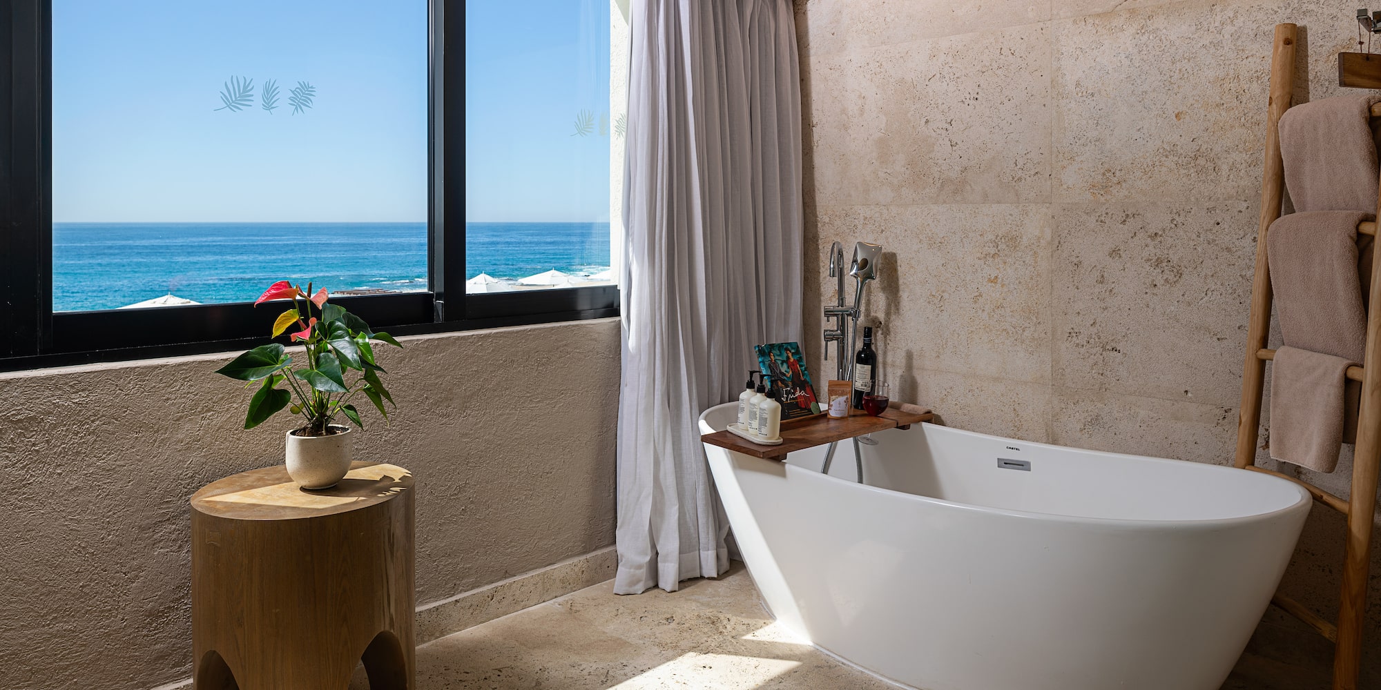 a bathroom with a tub and a window