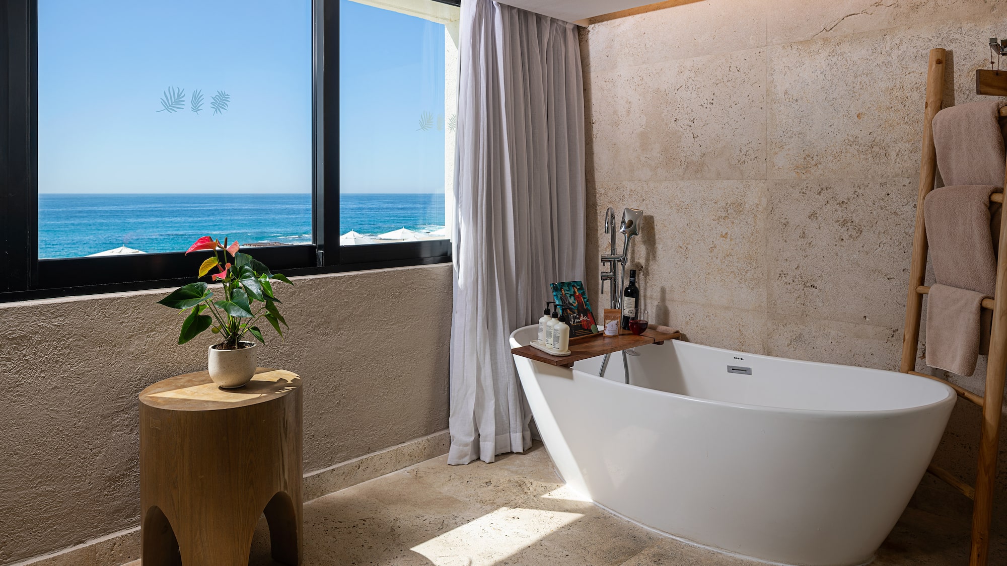 a bathroom with a tub and a window
