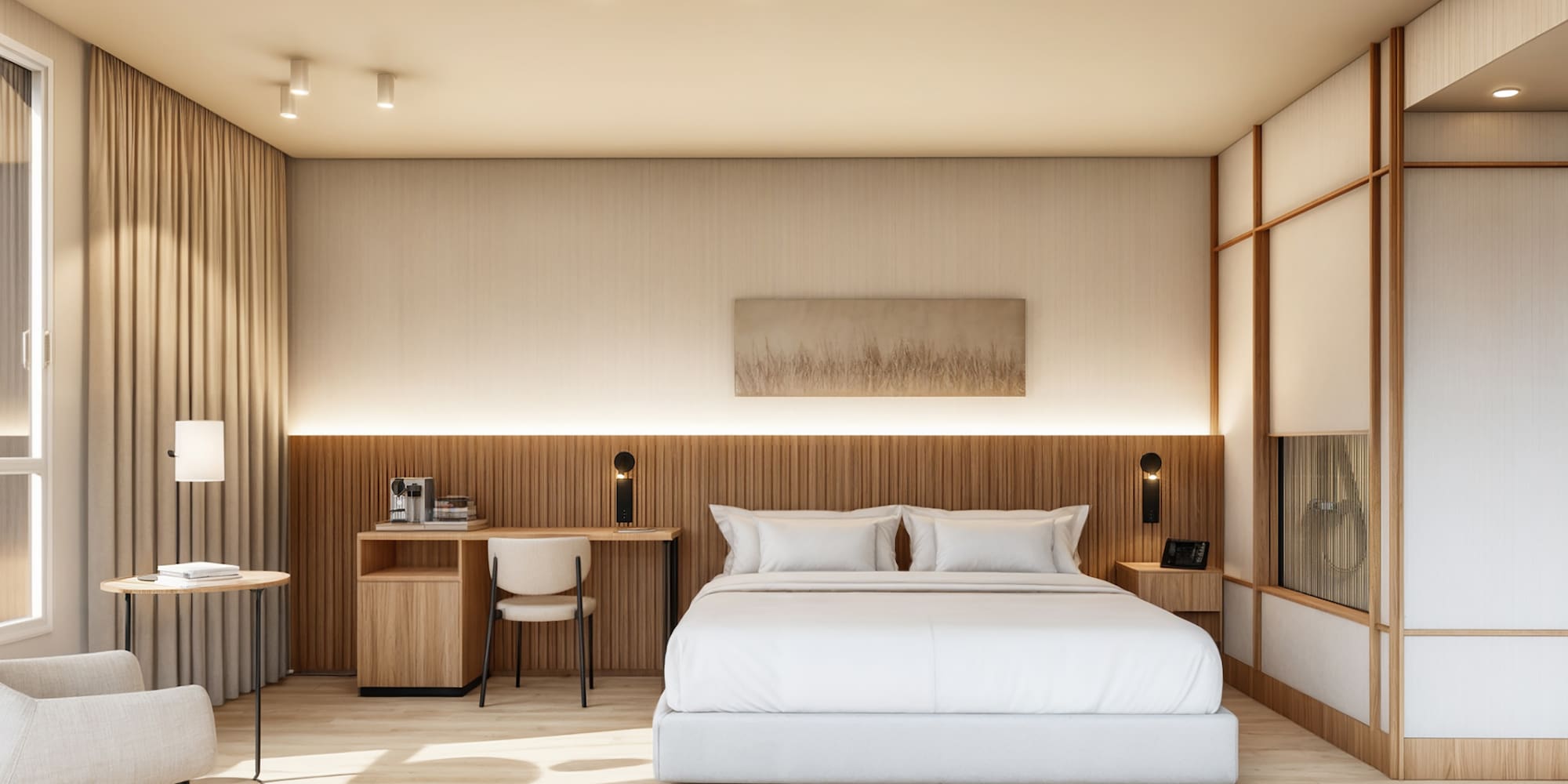 Suite de hotel moderna con cama blanca, decoración neutra y detalles de madera.