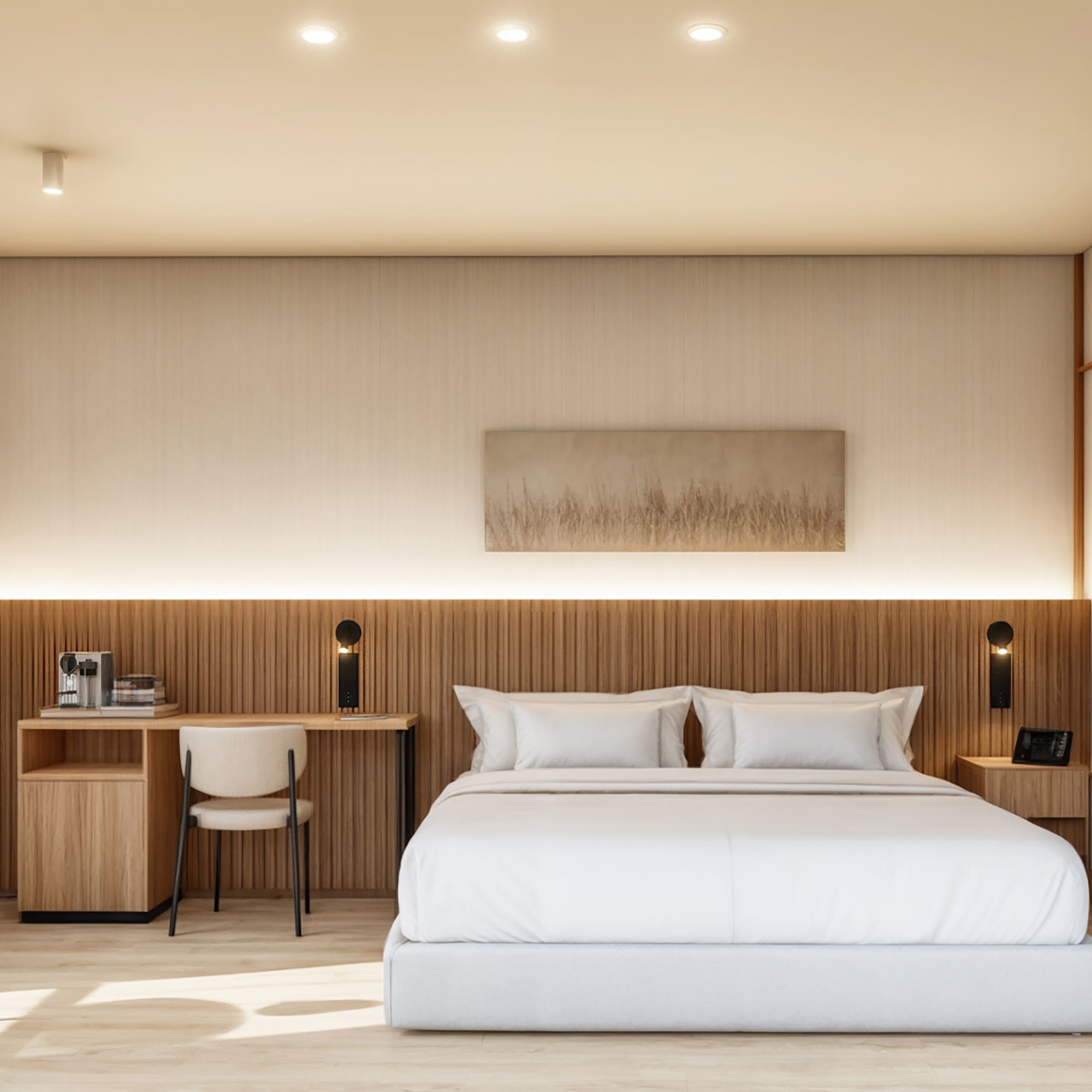 Suite de hotel moderna con cama blanca, decoración neutra y detalles de madera.