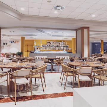 a room with tables and chairs