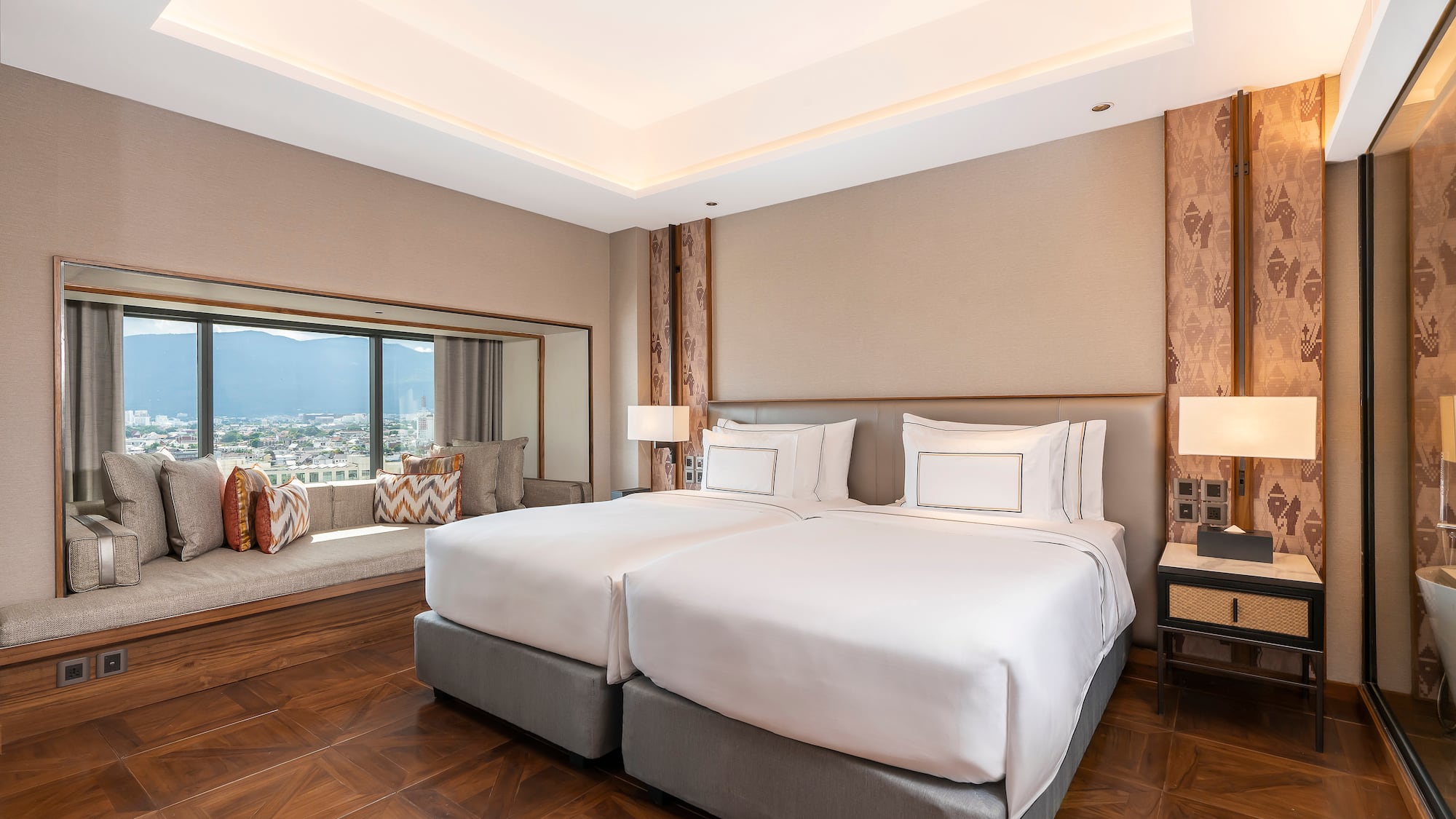 a room with two beds and a window