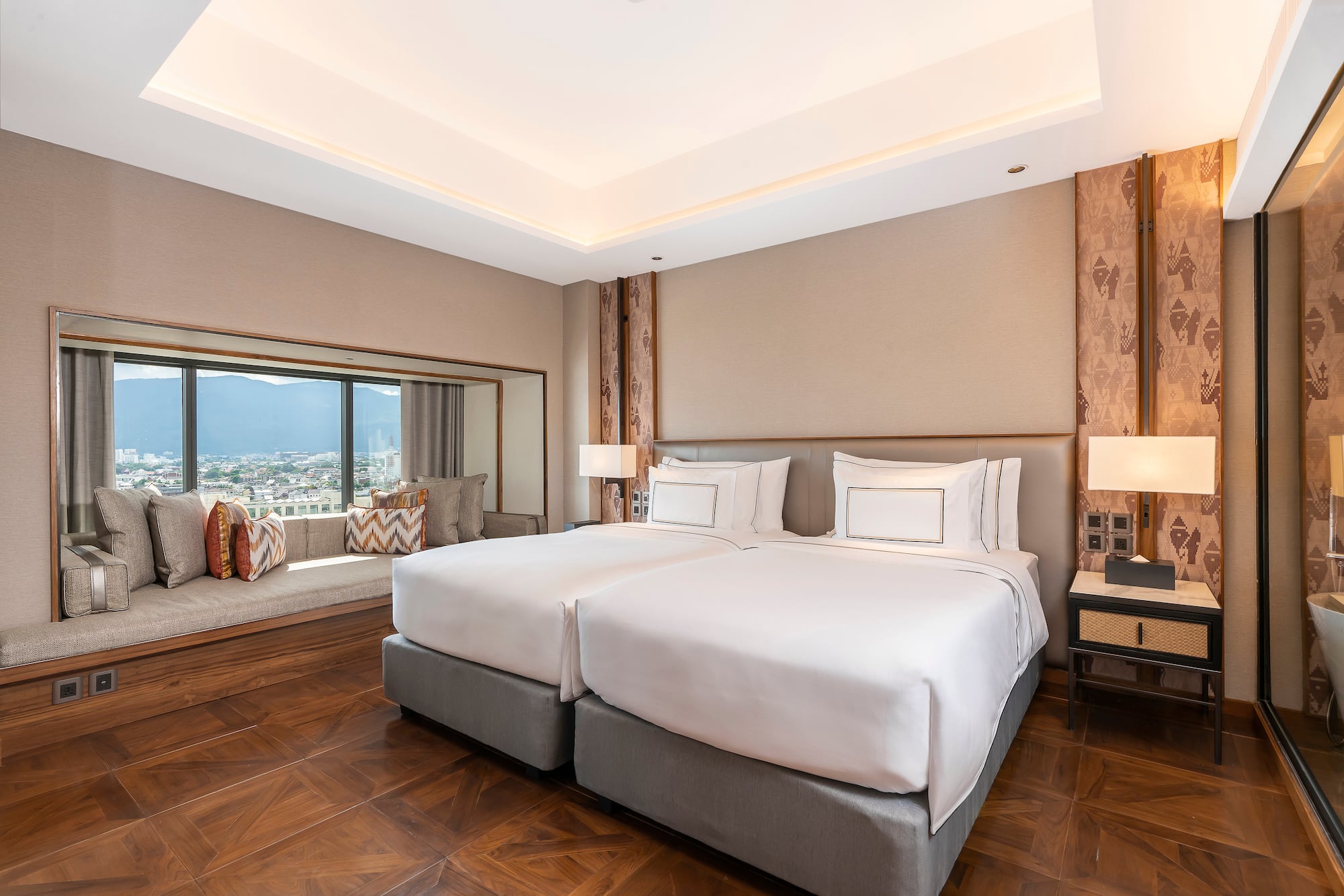 a room with two beds and a window