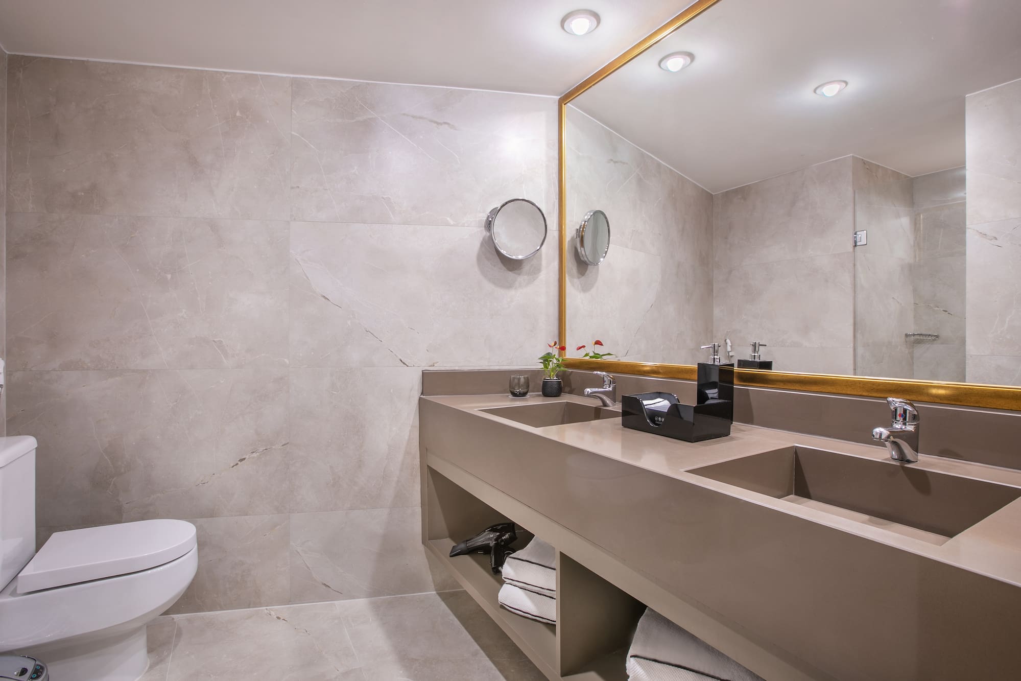 a bathroom with a large mirror and sinks