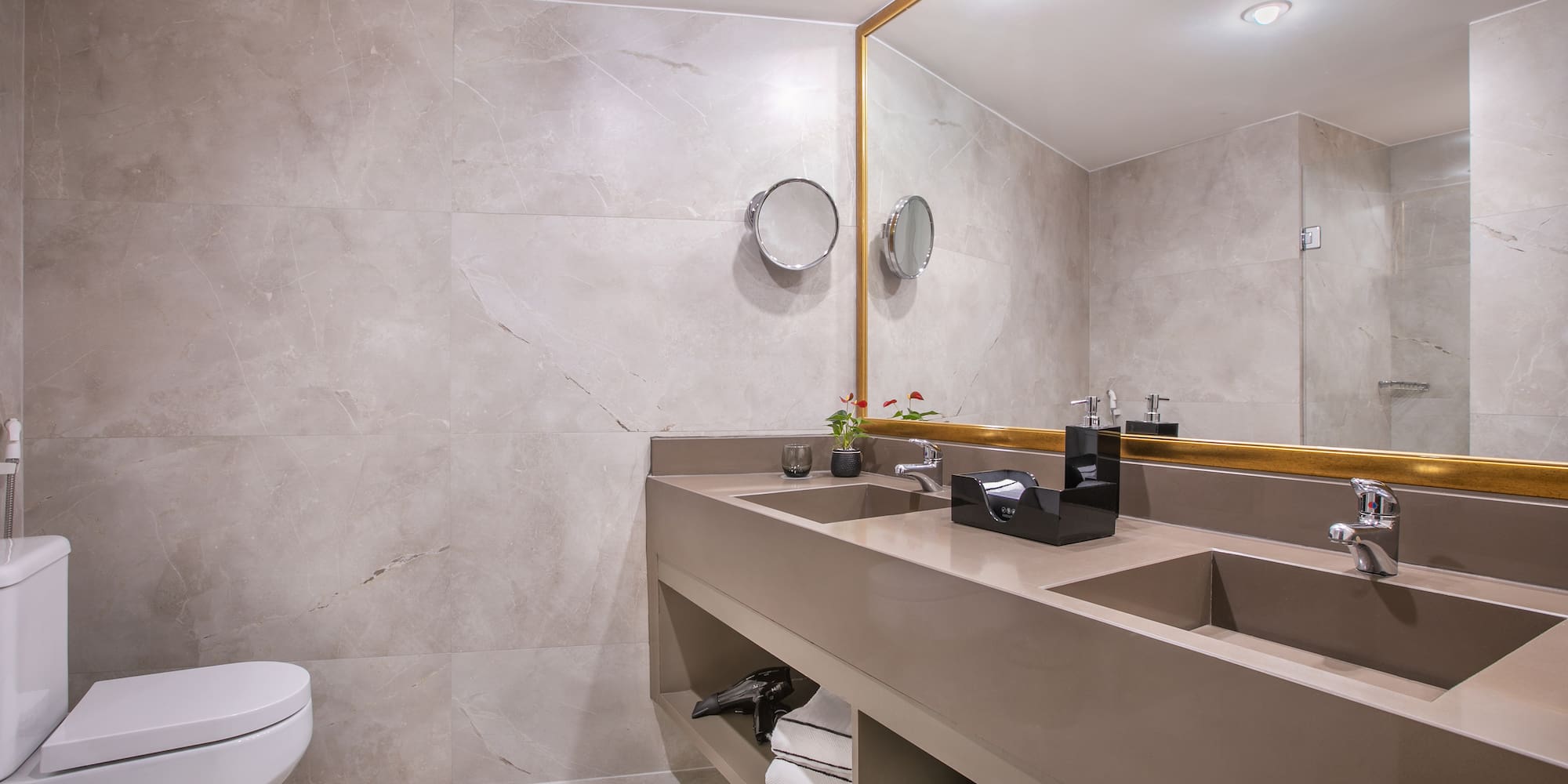 a bathroom with a large mirror and sinks