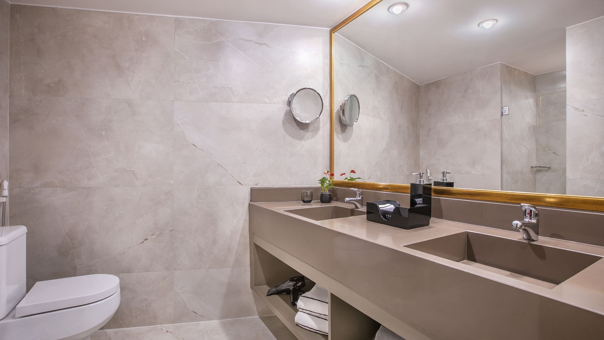 a bathroom with a large mirror and sinks
