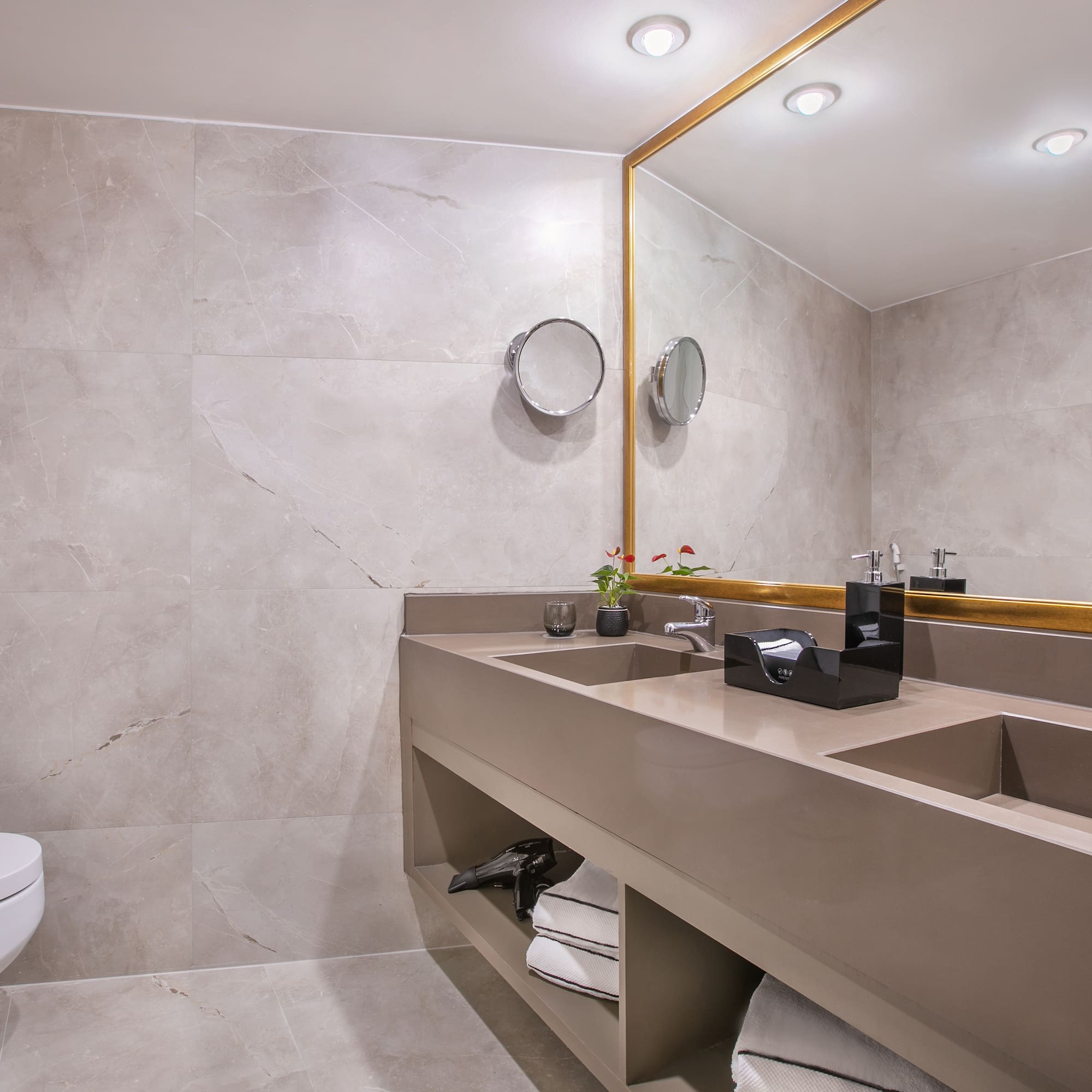 a bathroom with a large mirror and sinks