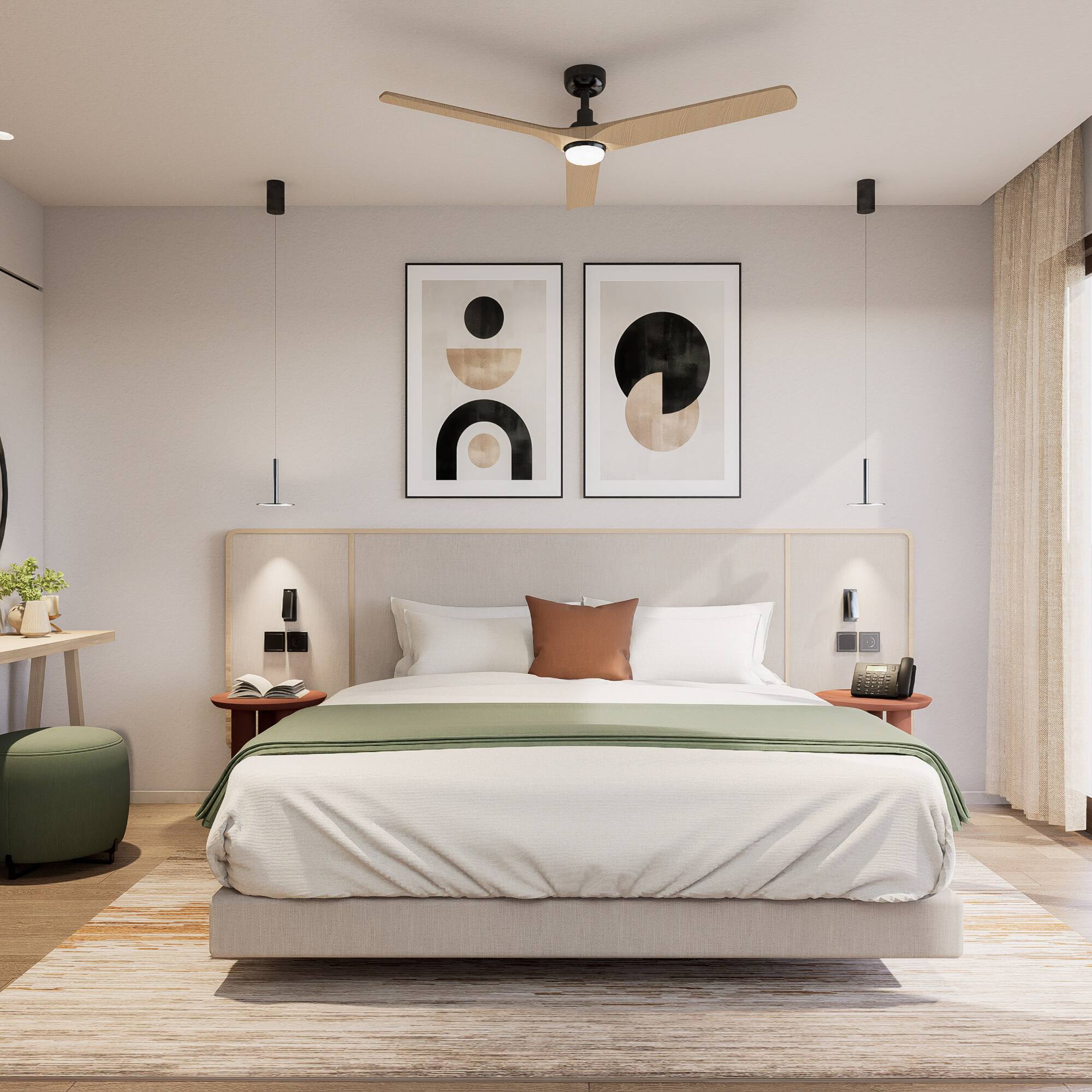 a bedroom with a bed and a desk and artwork