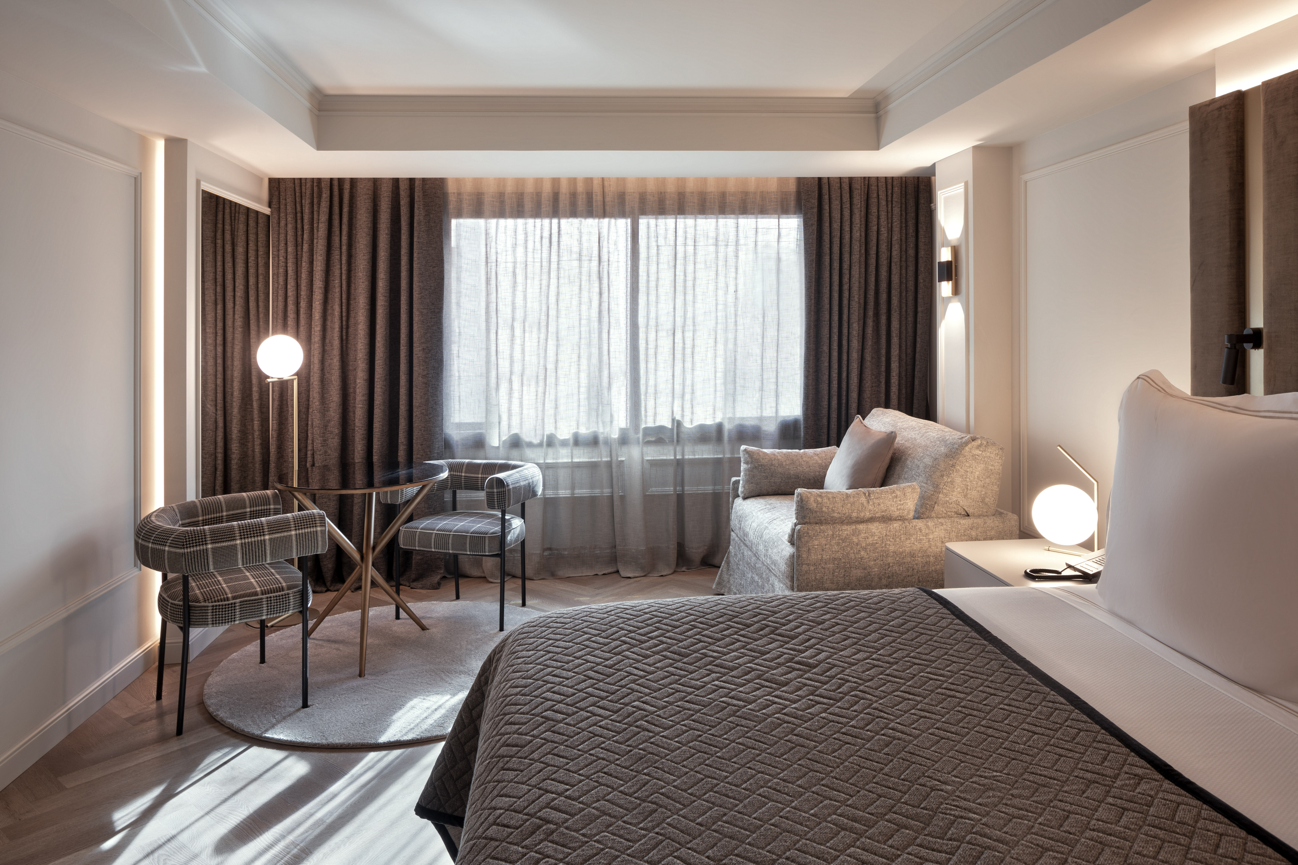 a bedroom with a bed and a lamp