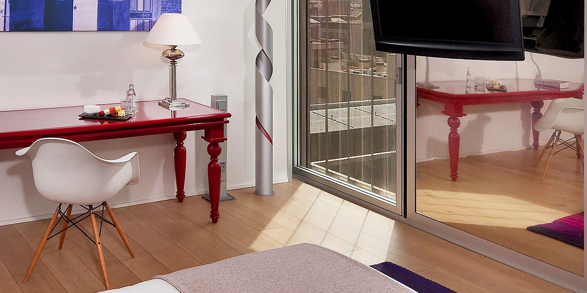 a bedroom with a bed and a desk