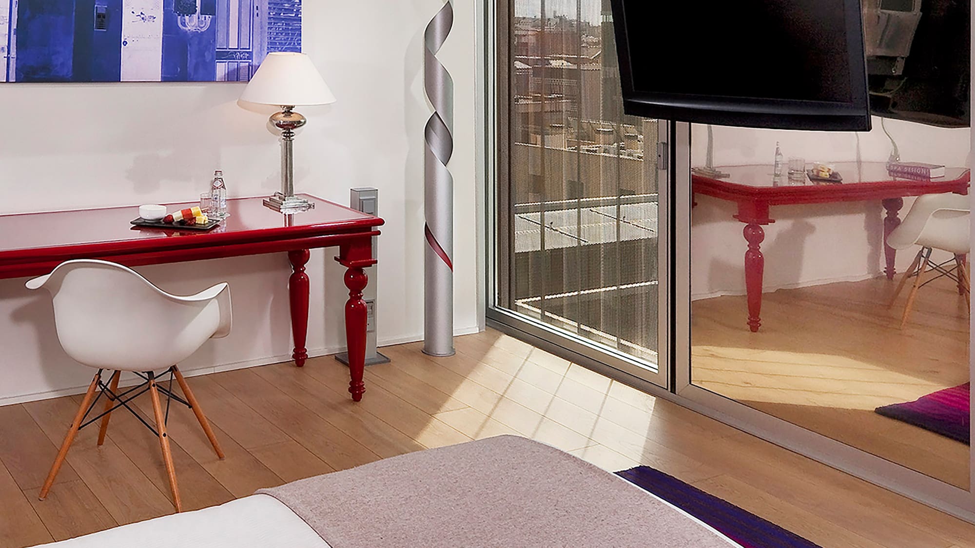 a bedroom with a bed and a desk