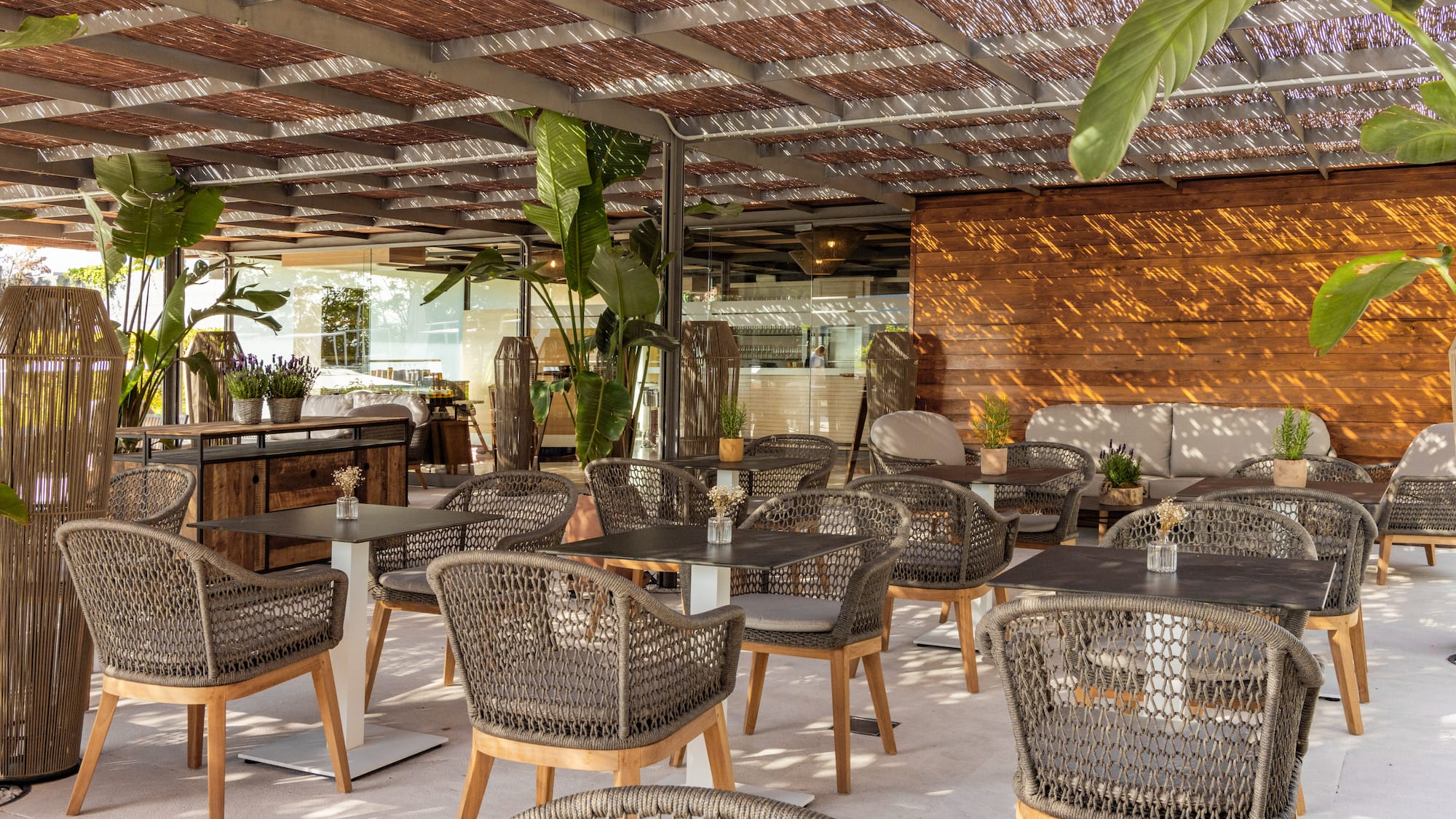 a patio with tables and chairs
