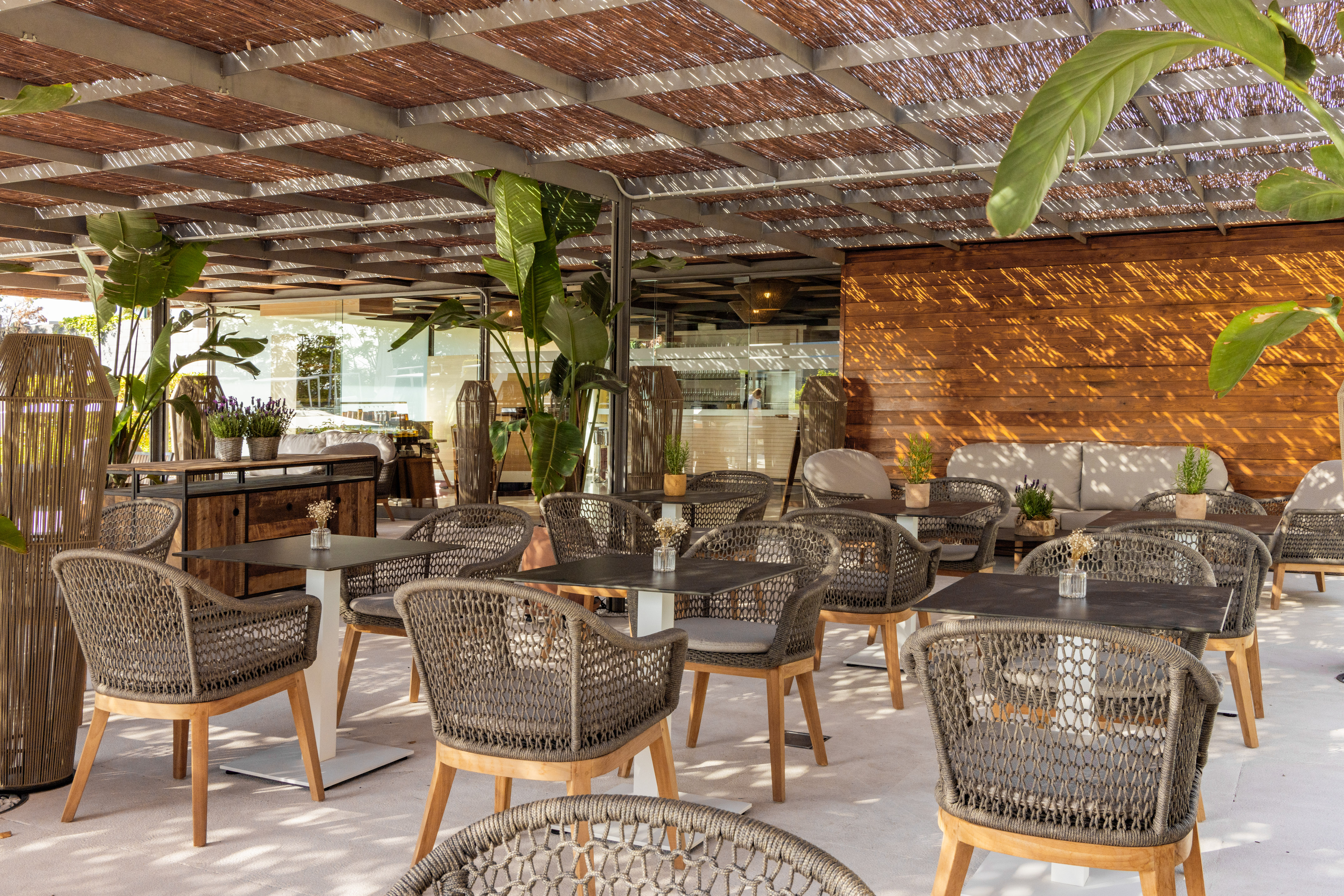 a patio with tables and chairs