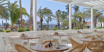 a restaurant with tables and chairs