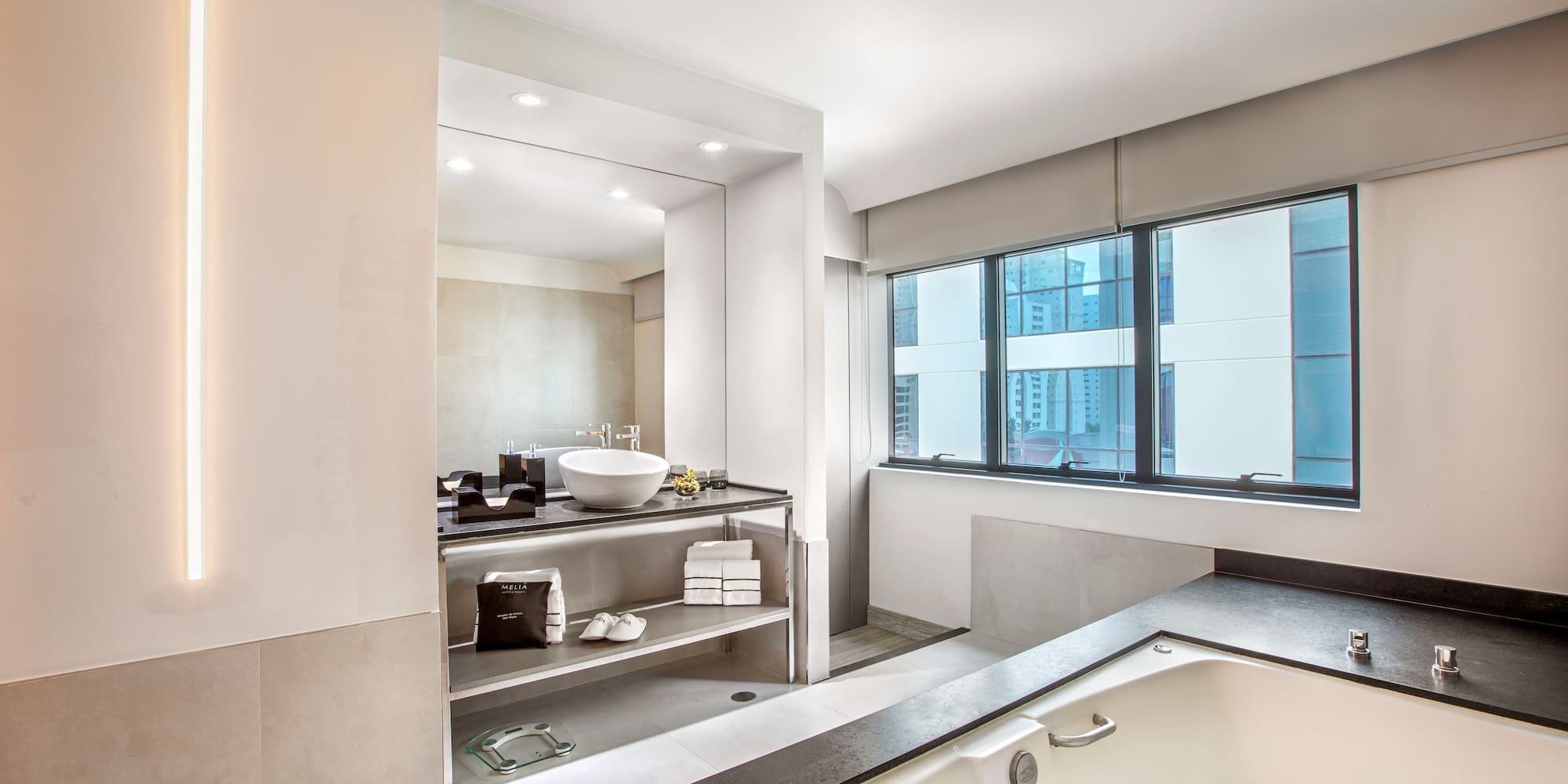 a bathroom with a tub and a sink