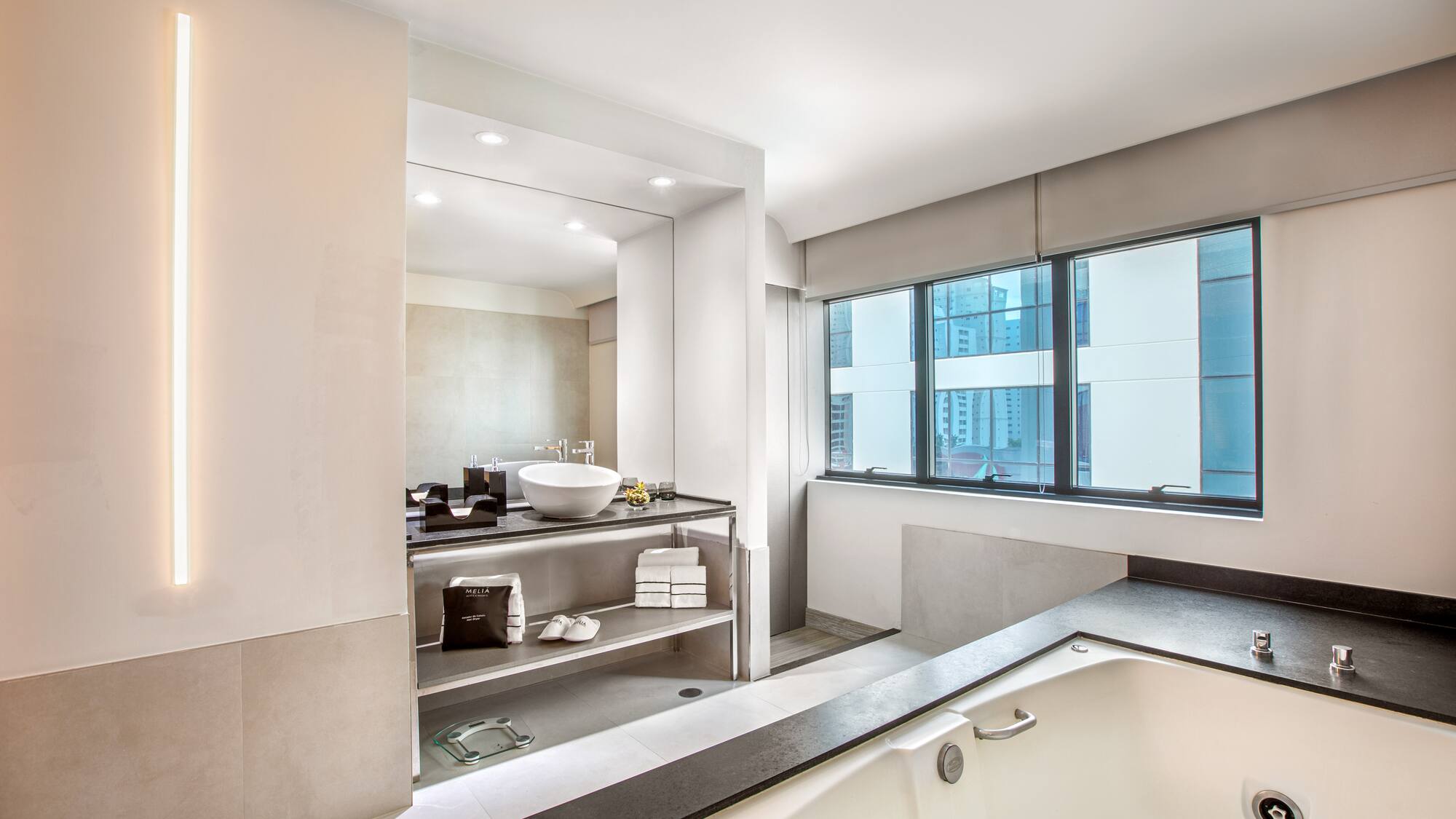 a bathroom with a tub and a sink