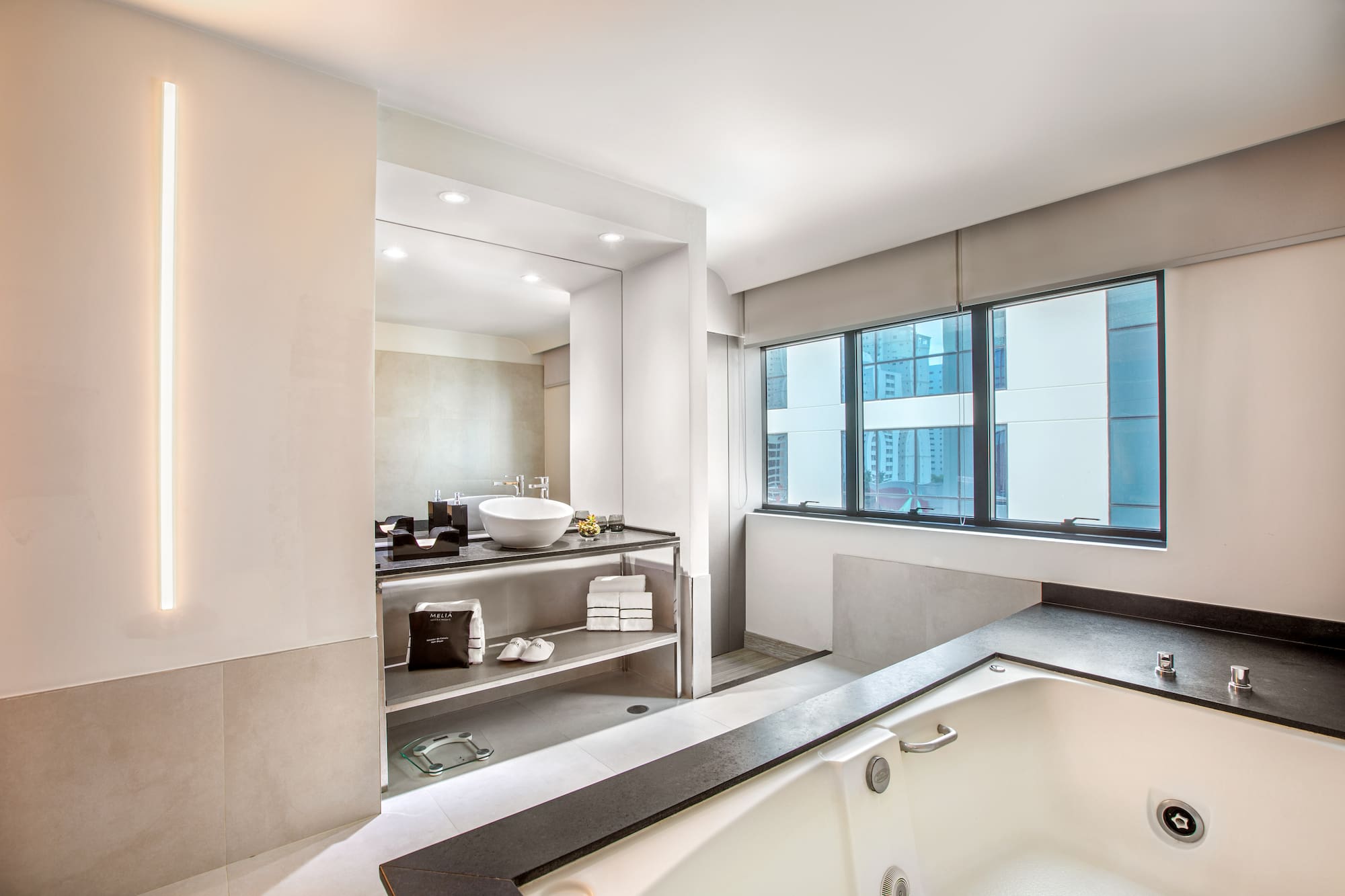 a bathroom with a tub and a sink