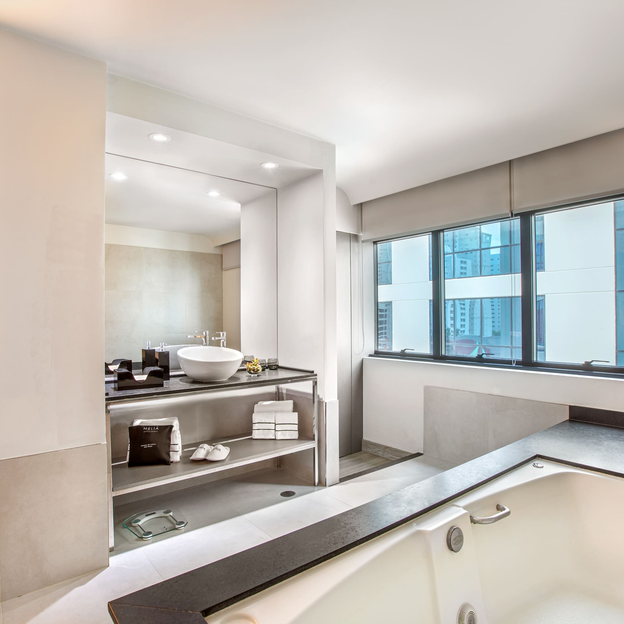 a bathroom with a tub and a sink