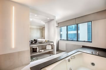 a bathroom with a tub and a sink