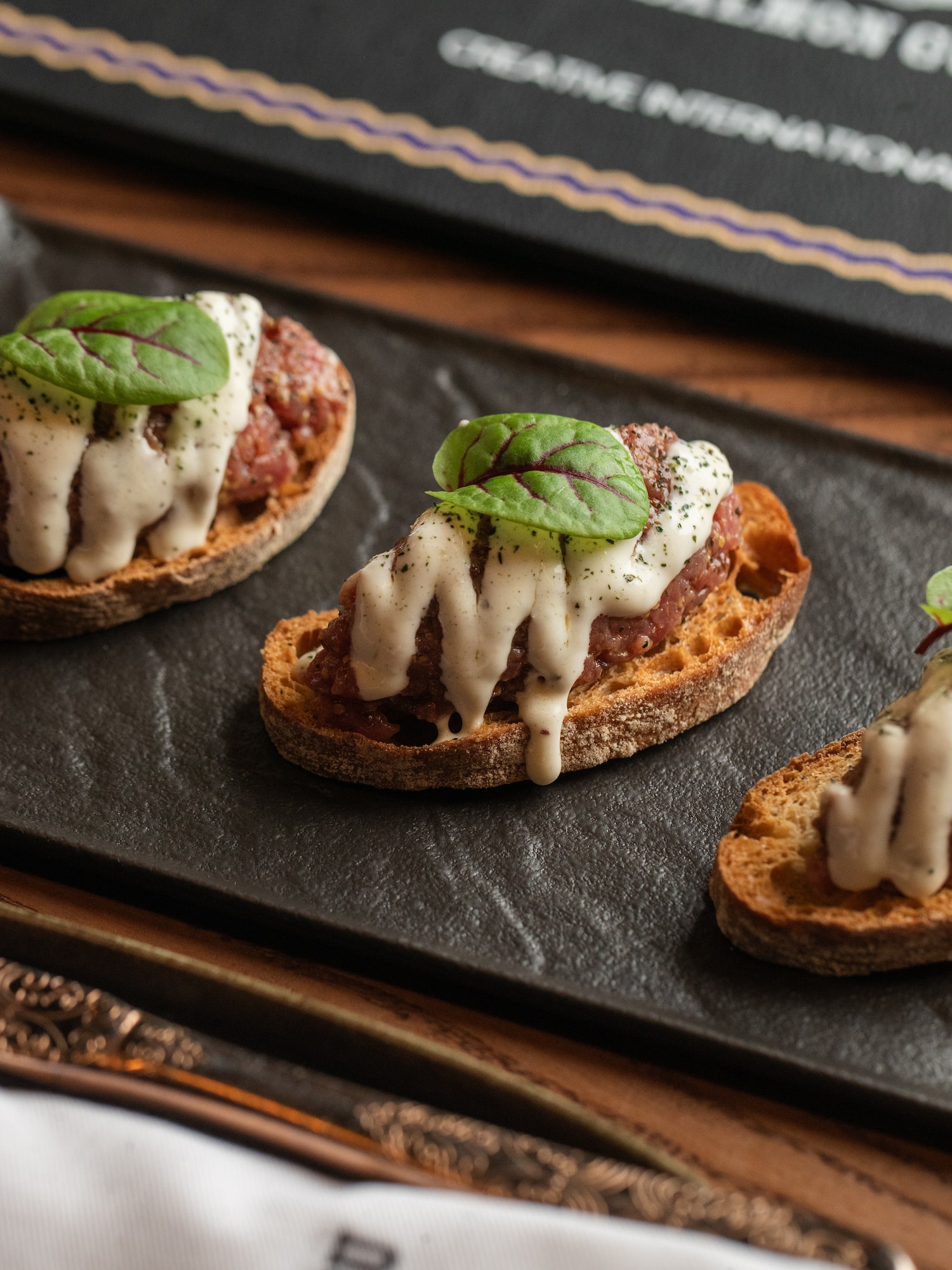a group of food on a black plate
