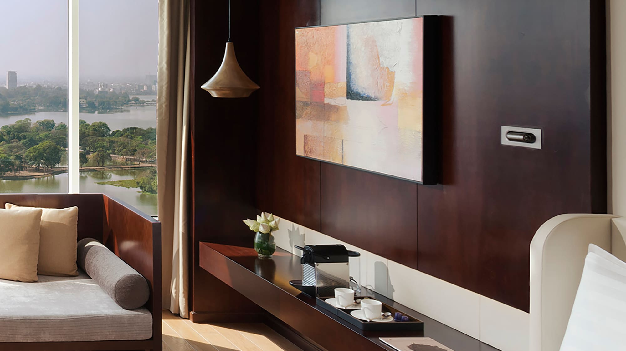 a room with a view of a city and a river