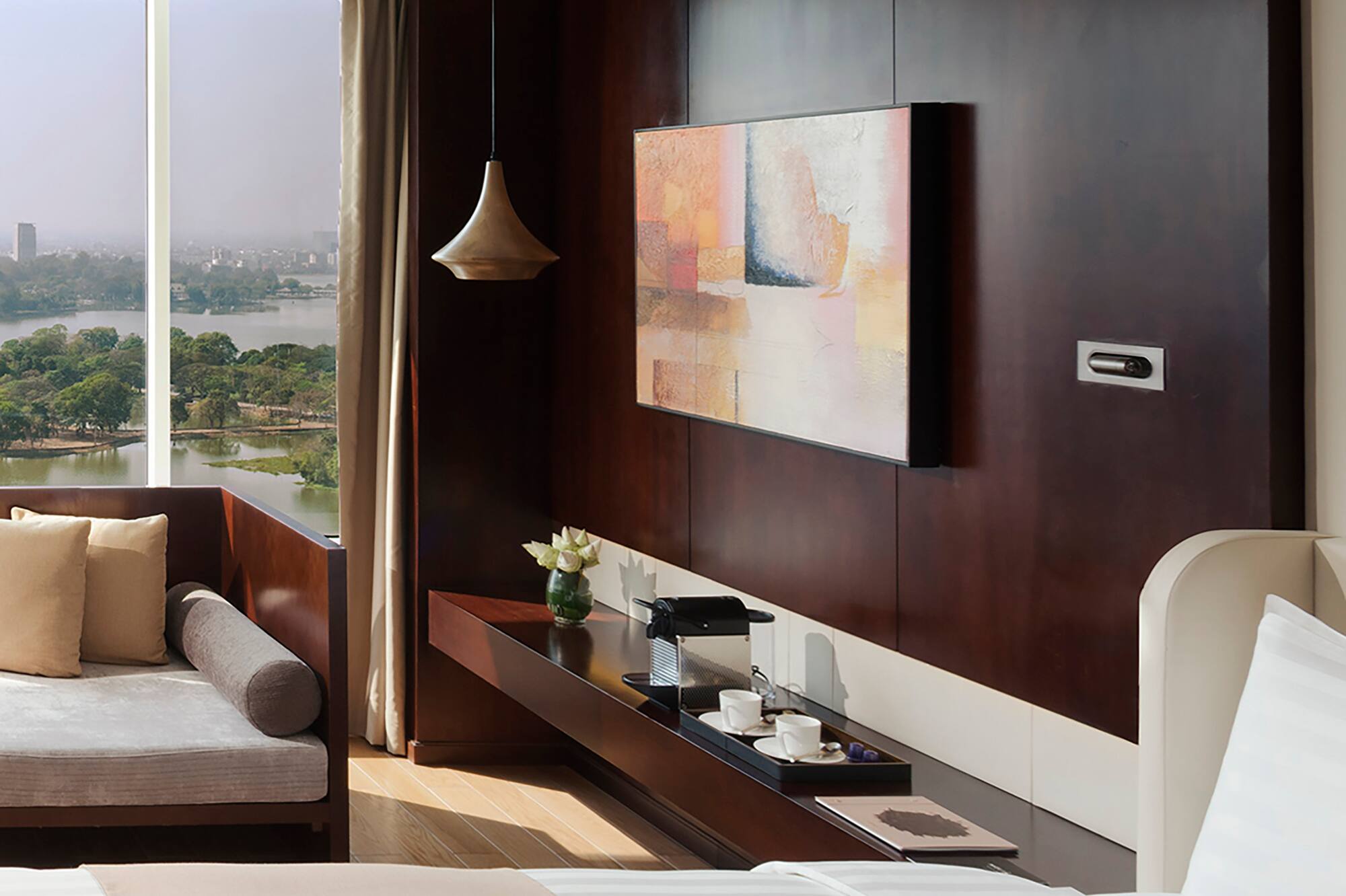 a room with a view of a city and a river