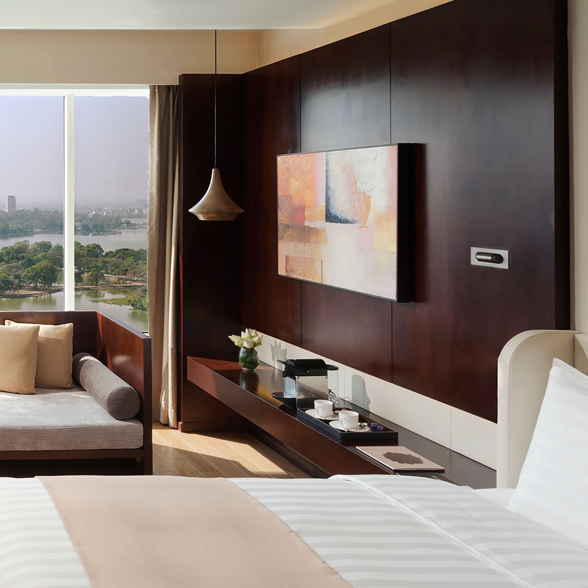 a room with a view of a city and a river