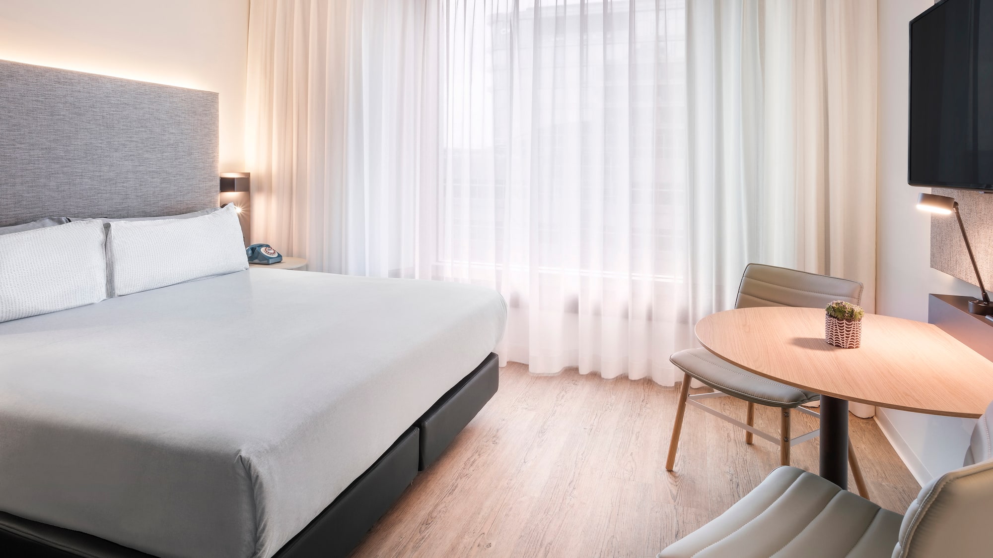 a room with a bed and a table