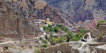 a car driving down a mountain