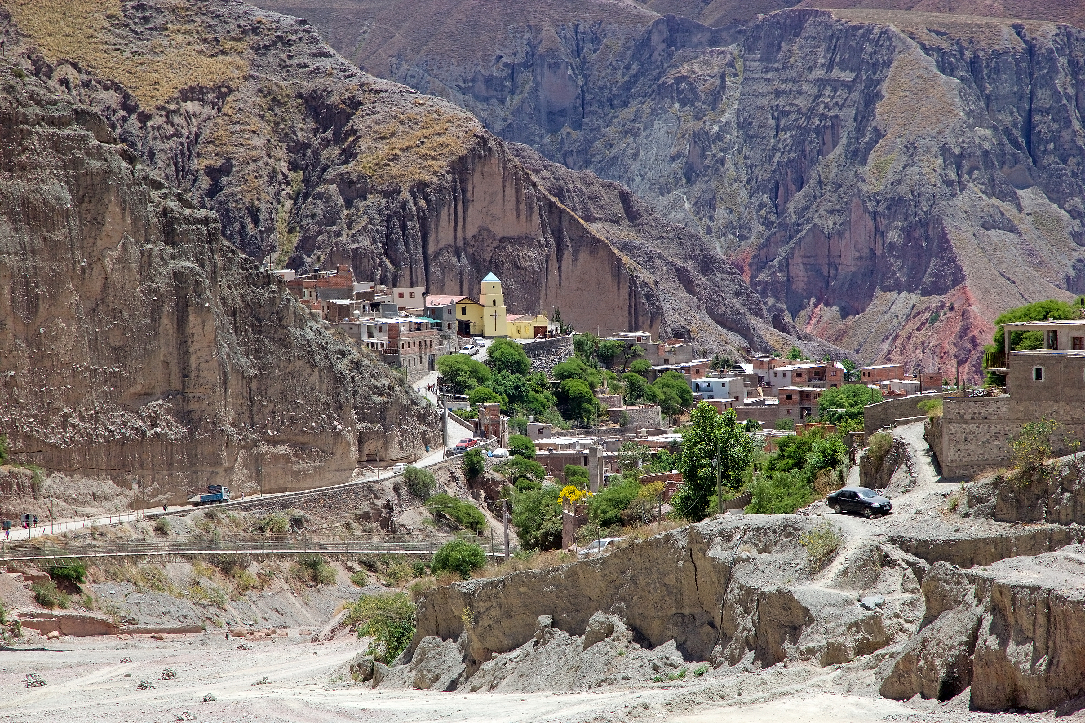 a car driving down a mountain