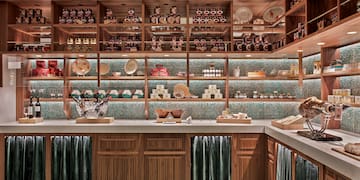 a kitchen with shelves and shelves