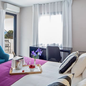 a room with a bed and a chair