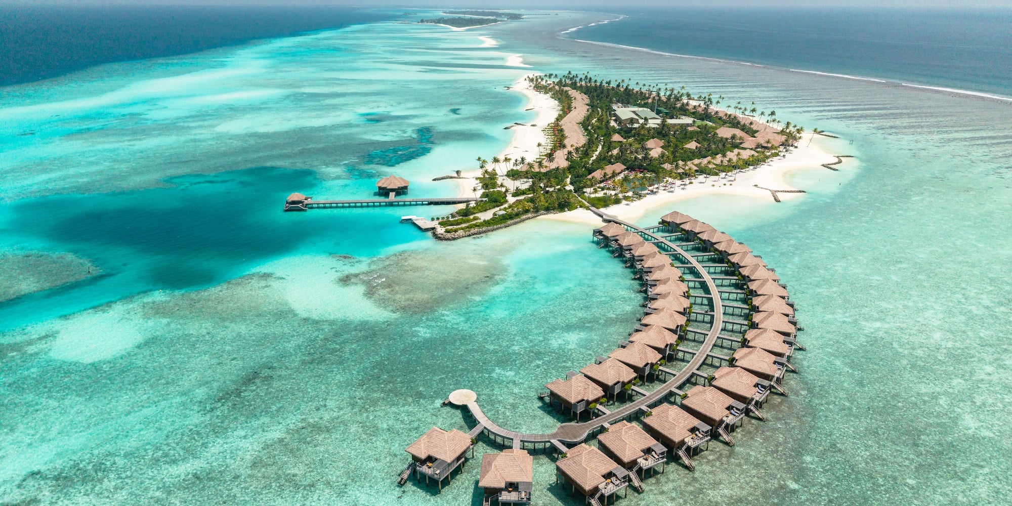 a group of huts on a small island