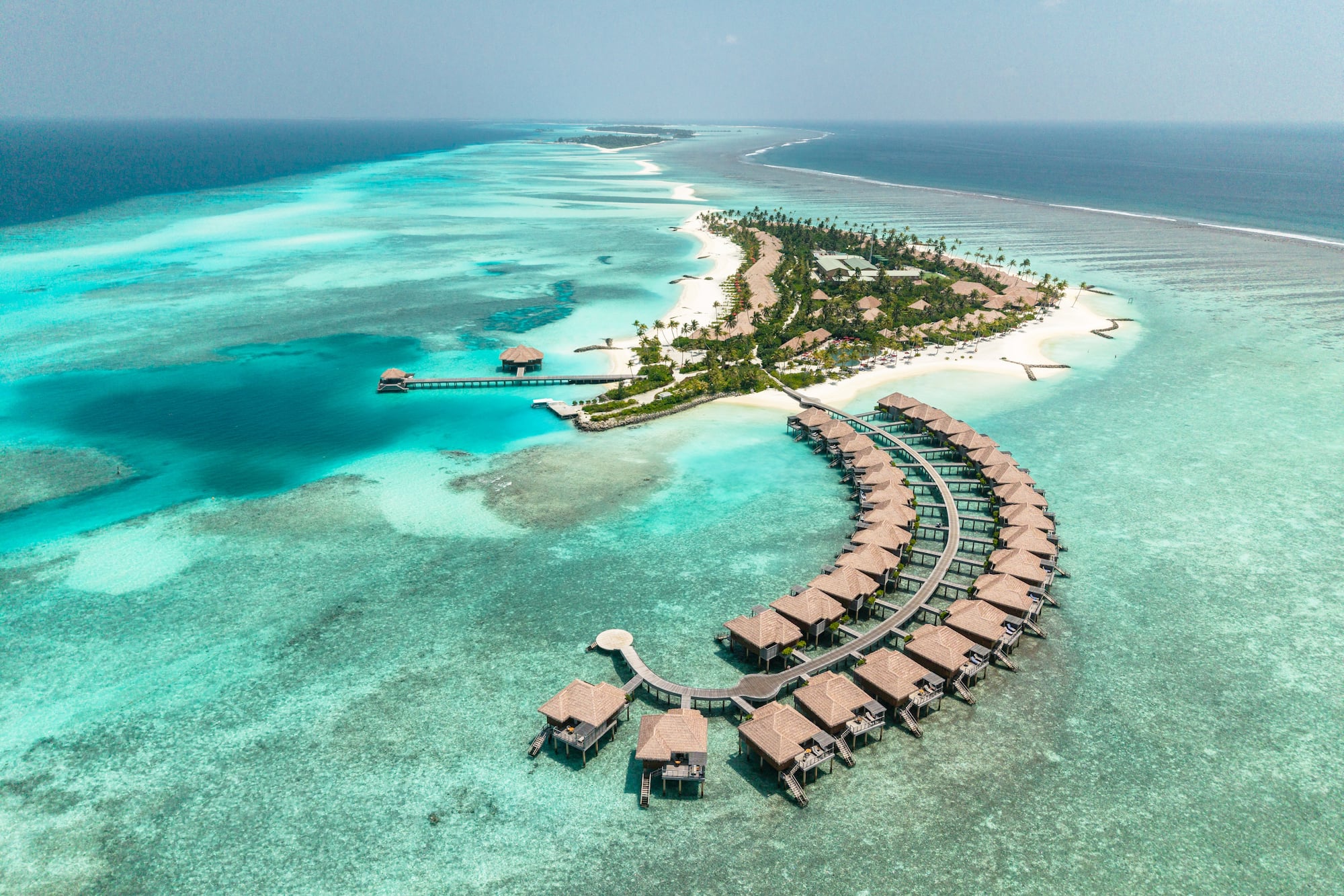 a group of huts on a small island