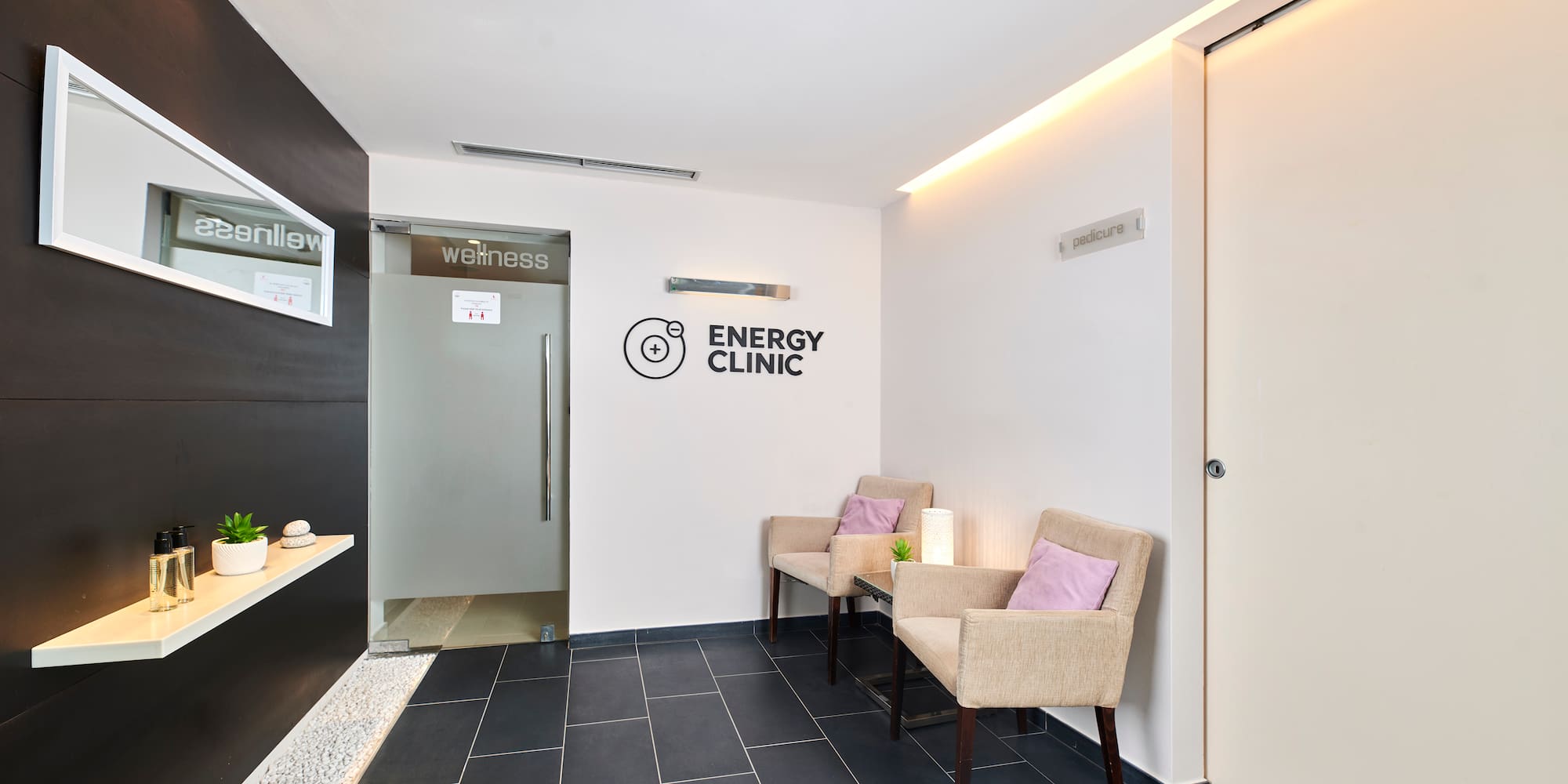 a room with chairs and a door