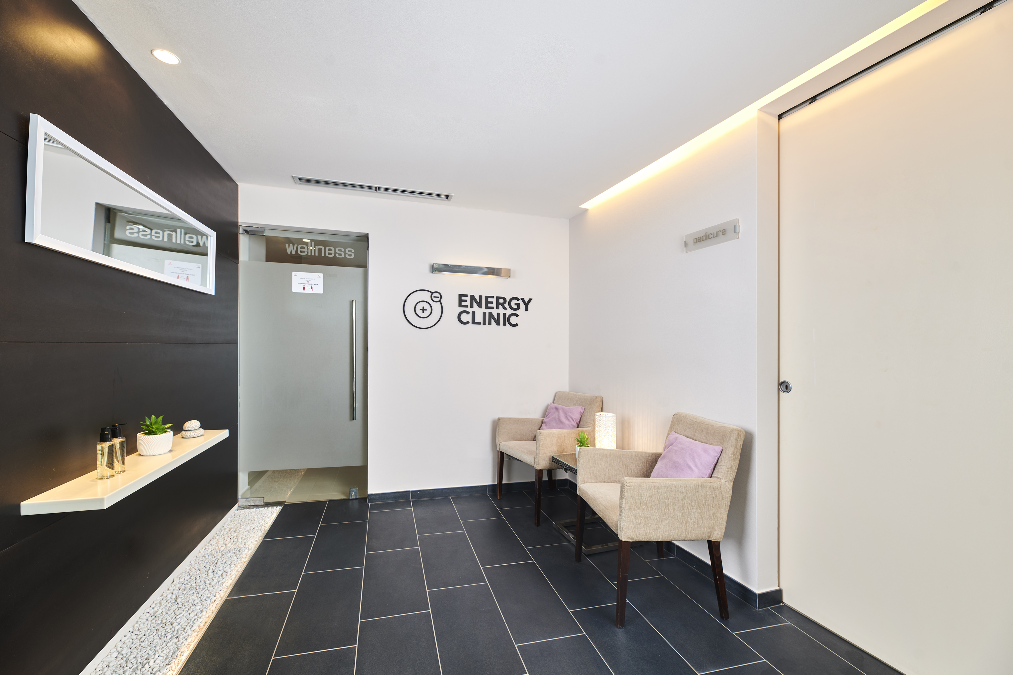 a room with chairs and a door