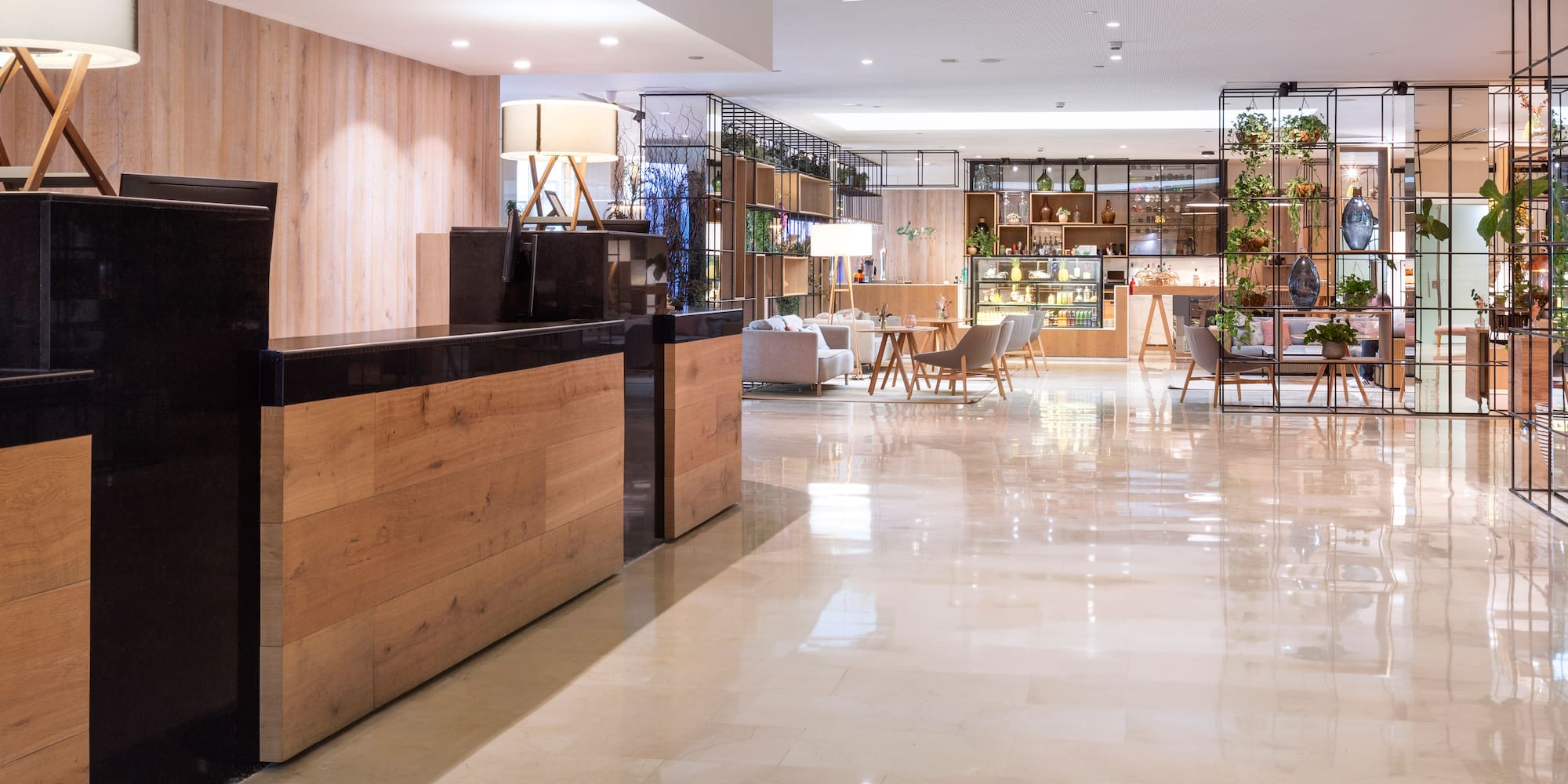a lobby with a reception desk and chairs