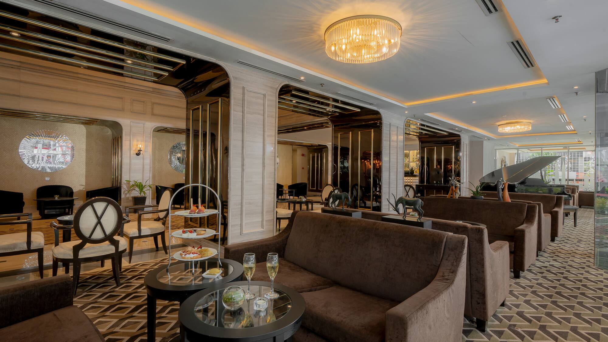 a room with couches and tables and chairs