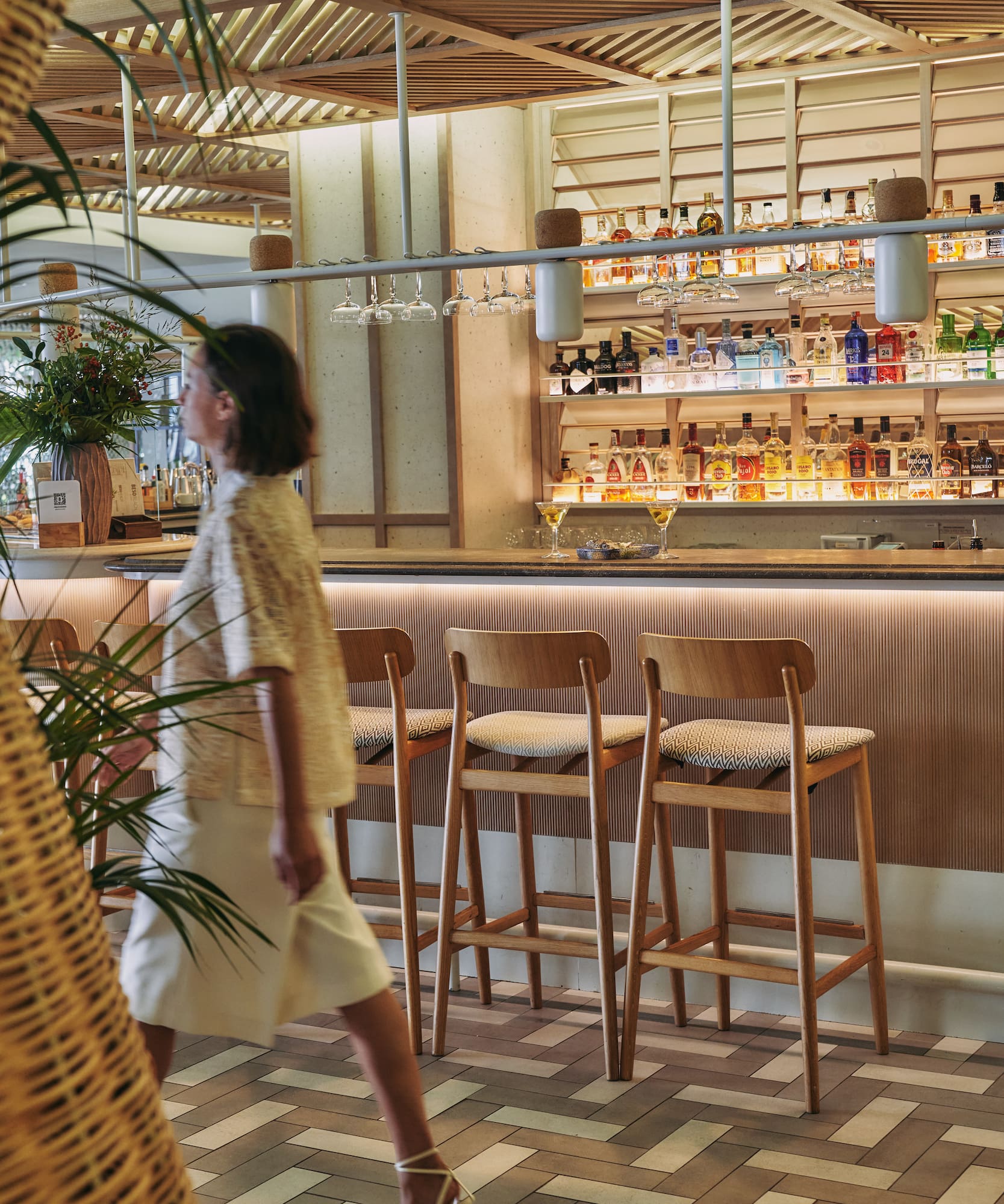 a woman walking in a bar