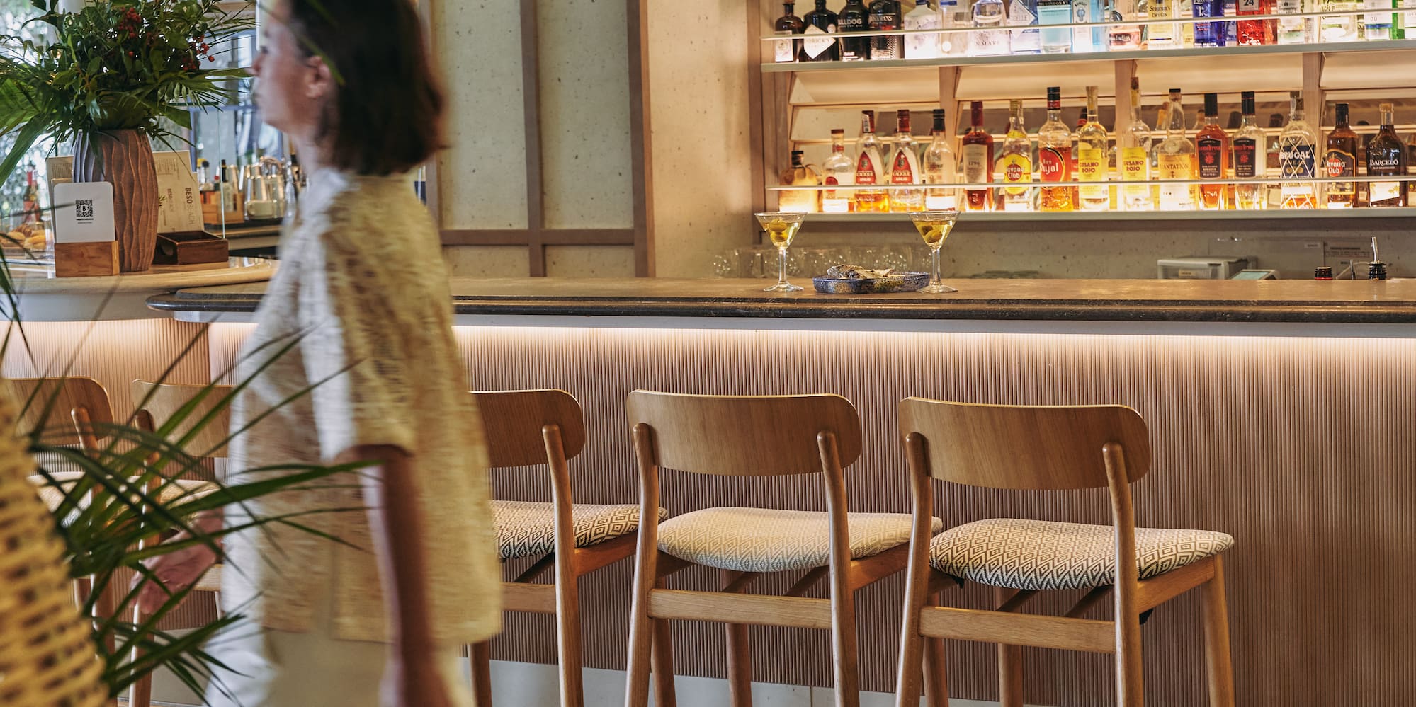 a woman walking in a bar